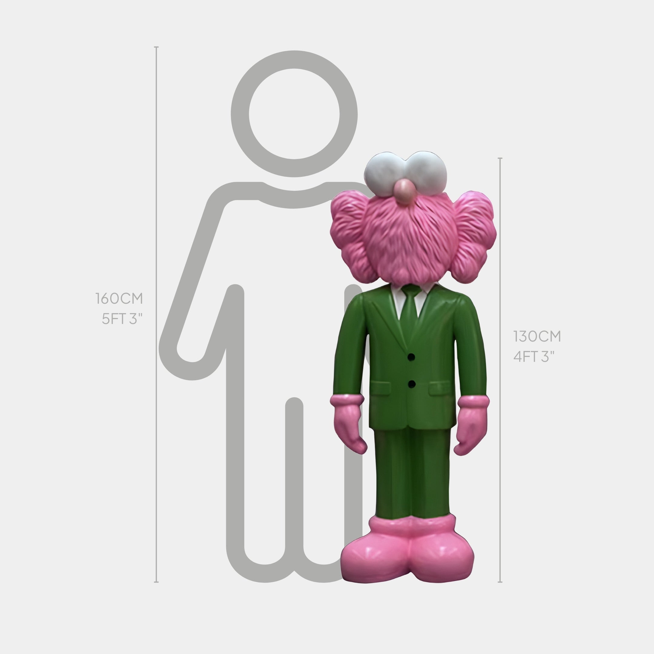 The Forest Green Suit Iconify CEO Sculpture from Giant Sculptures, standing 130 cm tall, is a playful pink cartoon figure before a human silhouette that stands 160 cm, embodying contemporary design with clearly displayed measurements.