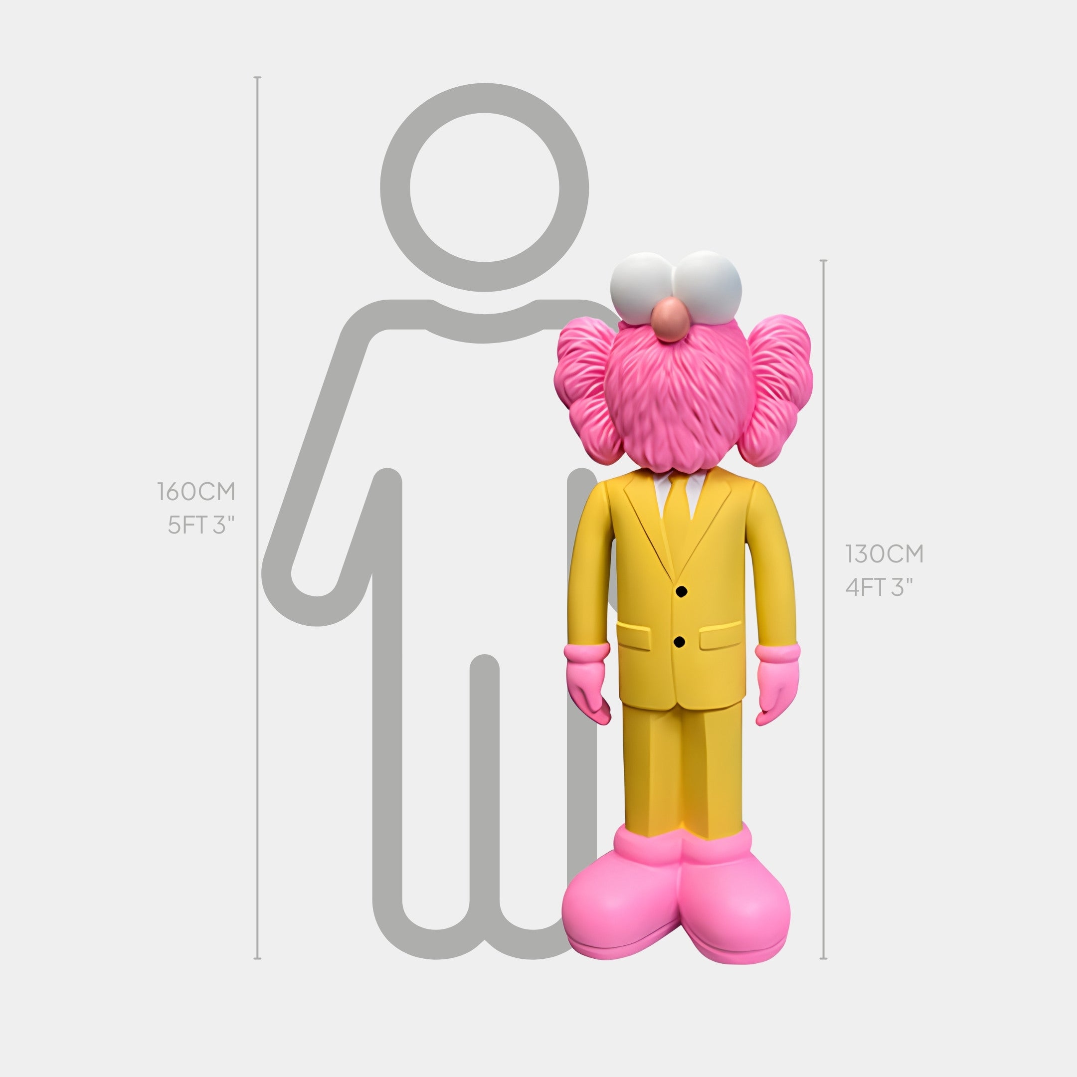 The Sunbeam Yellow Suit Iconify CEO Sculpture by Giant Sculptures, featuring a pink-eared character in a yellow suit and pink shoes, stands 130 cm (4 ft 3 in) tall beside a 160 cm (5 ft 3 in) height comparison silhouette.