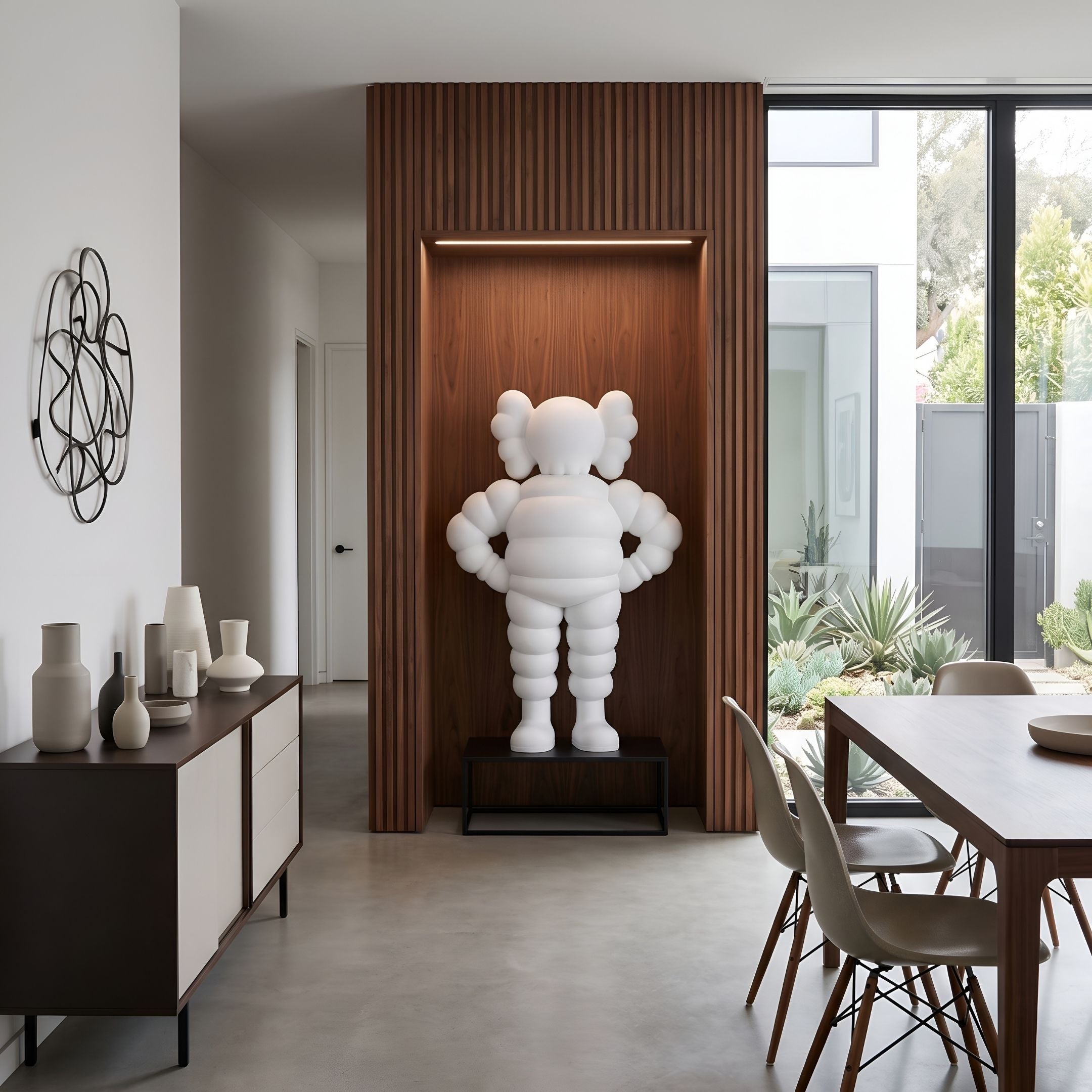 Cloud White Iconify Rollo Warrior Sculpture, 130cm, on a black stand in a wood-paneled dining nook near a sideboard and table.
