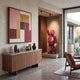 Blush Ruby Iconify Anatomy Sculpture, 130cm, on a platform in an entryway with anatomical cutaway detail in red and pink tones, near a wood sideboard and abstract wall art.