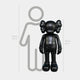 Midnight Black Iconify Standing Sculpture by Giant Sculptures, a 130cm matte black figure with rounded ears, shown beside a 160cm human silhouette for scale.