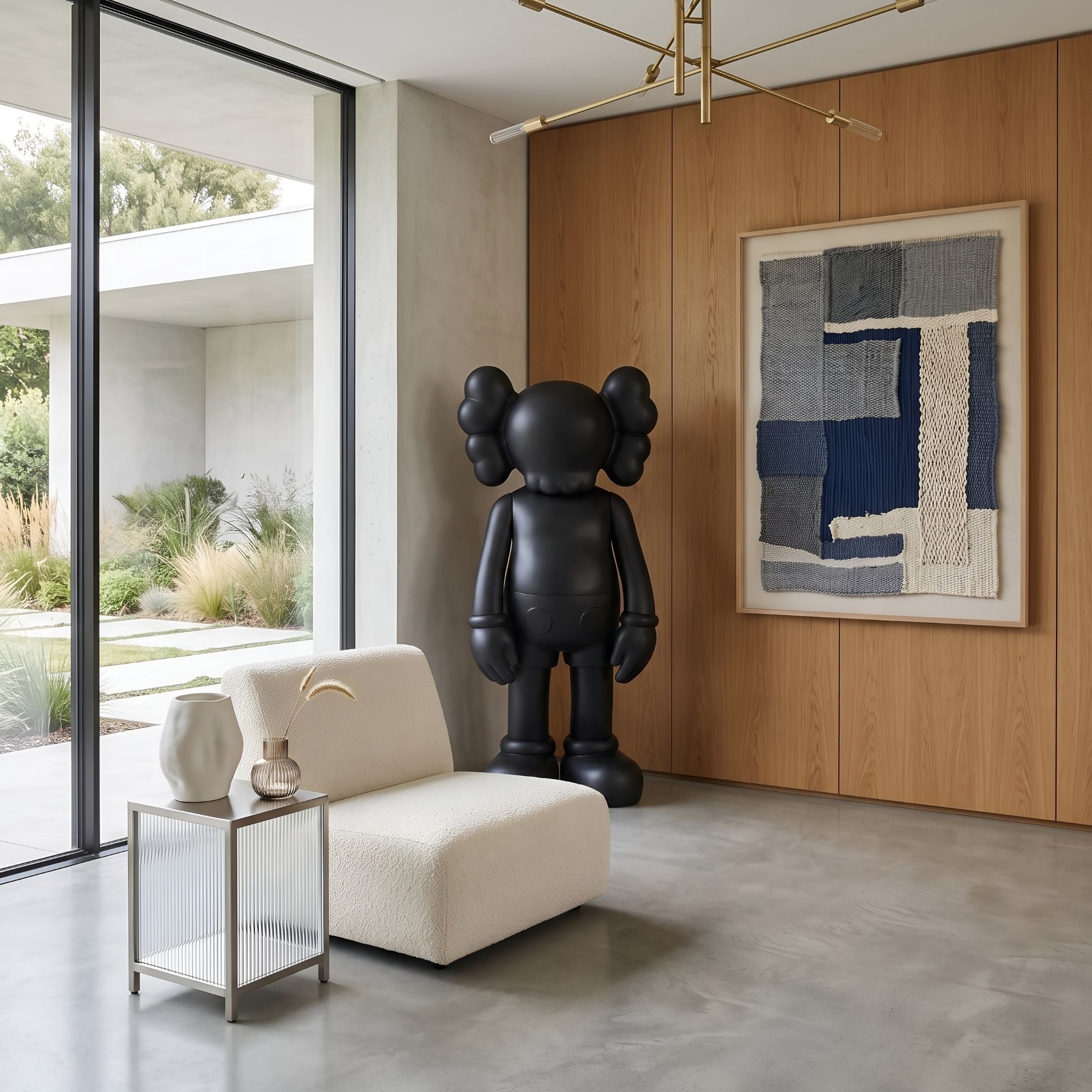 Midnight Black Iconify Standing Sculpture, 130cm, in a living room beside a woven blue wall art and cream boucle chair.