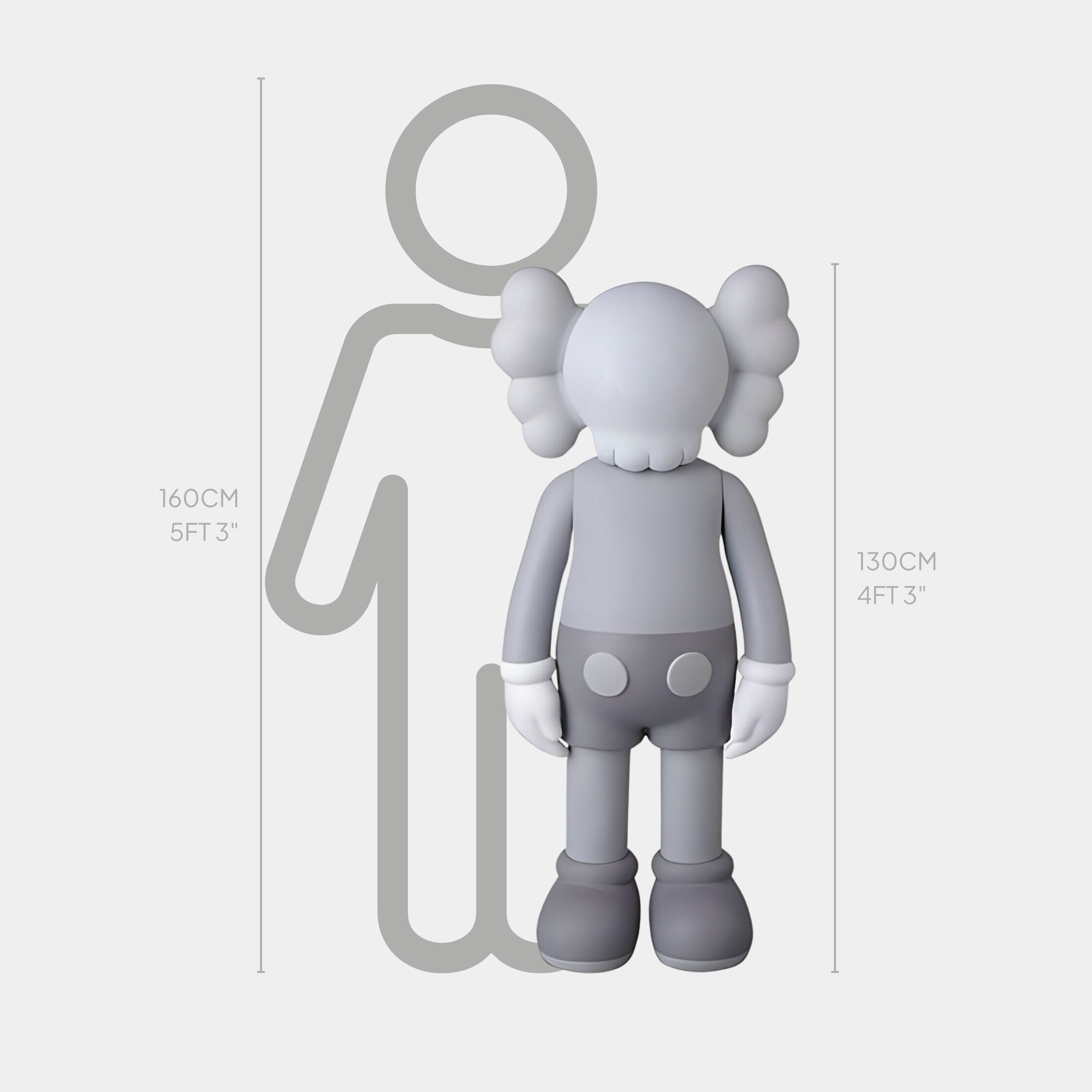 The Soft Grey Iconify Standing Sculpture by Giant Sculptures features a gray cartoon character with large hands, feet, and cross-shaped eyes next to a silhouette. At 130cm (4ft 3in), it contrasts the 160cm (5ft 3in) figure, perfect for adding modern elegance to your decor.