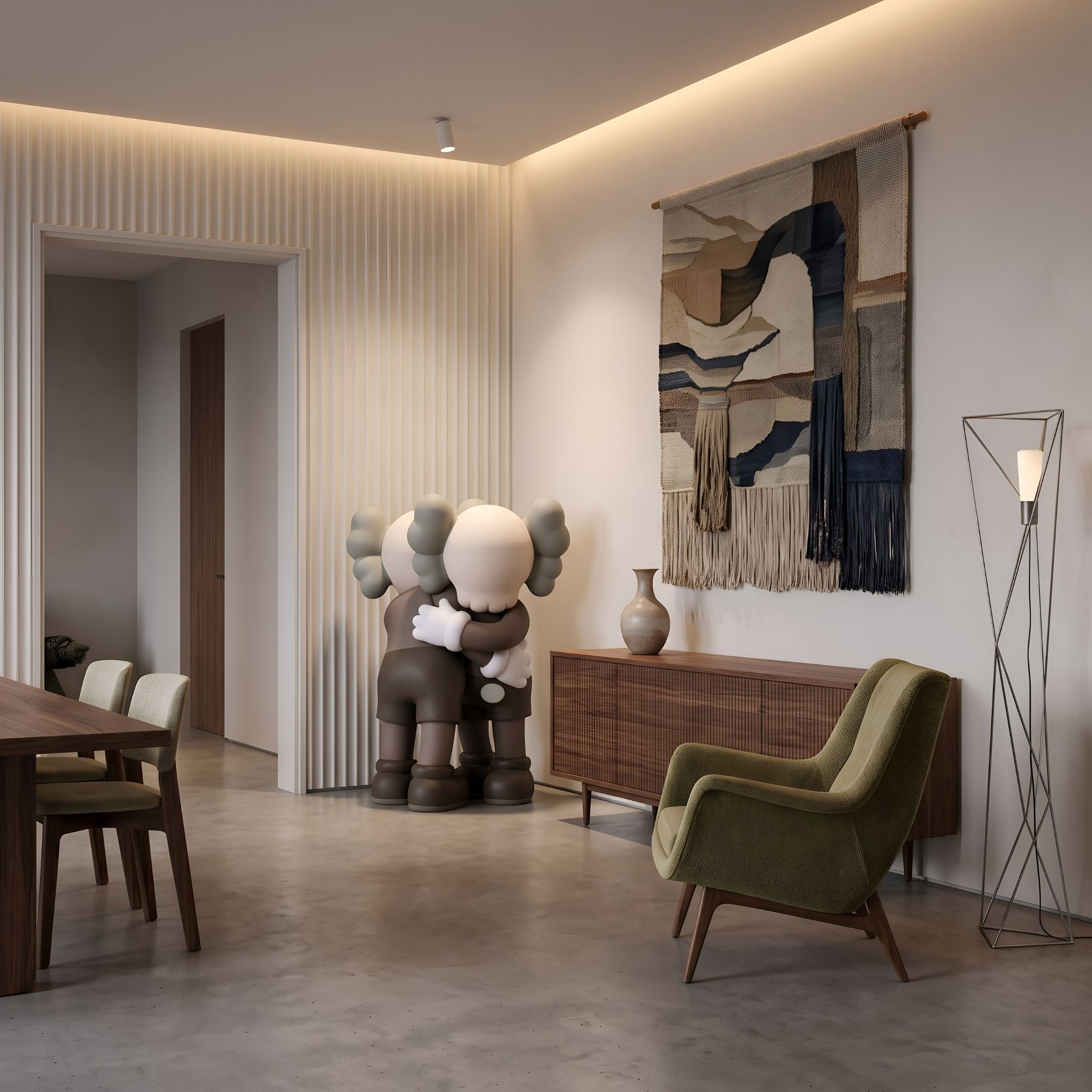 Hazelnut Brown Iconify Embrace Sculpture, 135cm, resin figures hugging, shown in a living room beside a walnut sideboard and green armchair.
