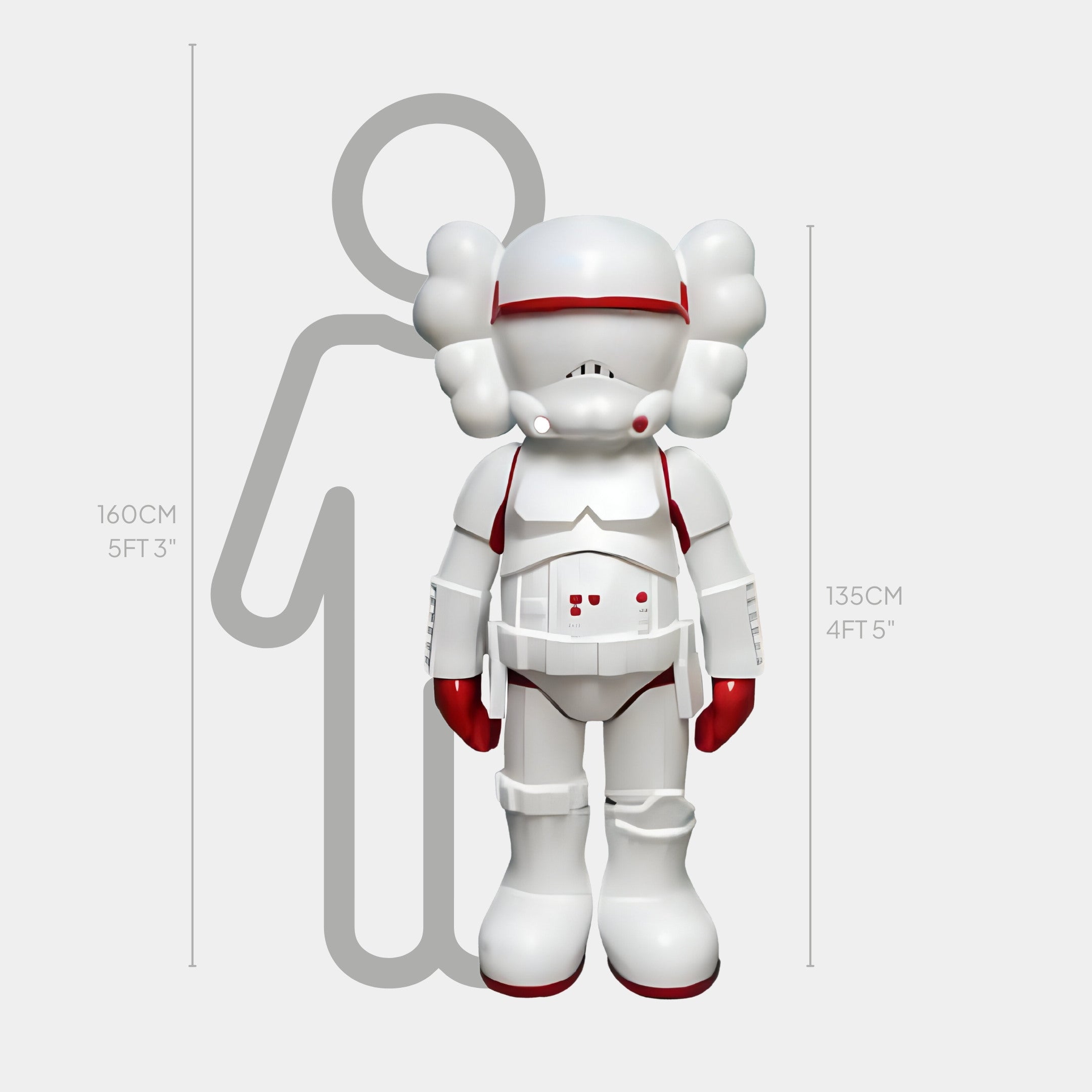 The 135 cm Giant Sculptures Red & White Iconify Enforcer Sculpture stands futuristically elegant with a helmet, puffy ears, and red hands before a taller gray human outline measuring 160 cm.