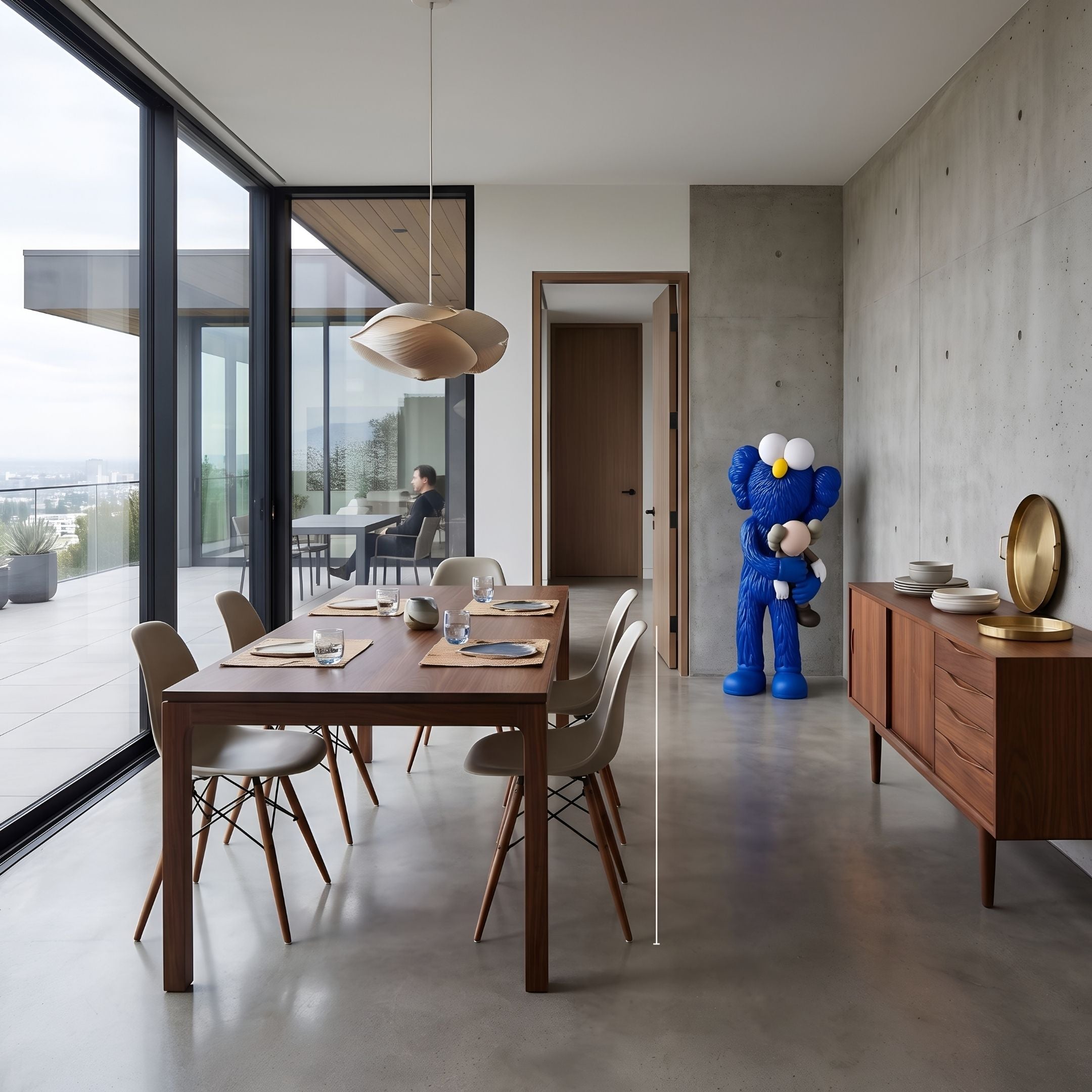 Deep Blue Iconify Loving Furry Sculpture, 135cm, embracing a small black-and-white figure, displayed in a dining room beside a wooden sideboard.