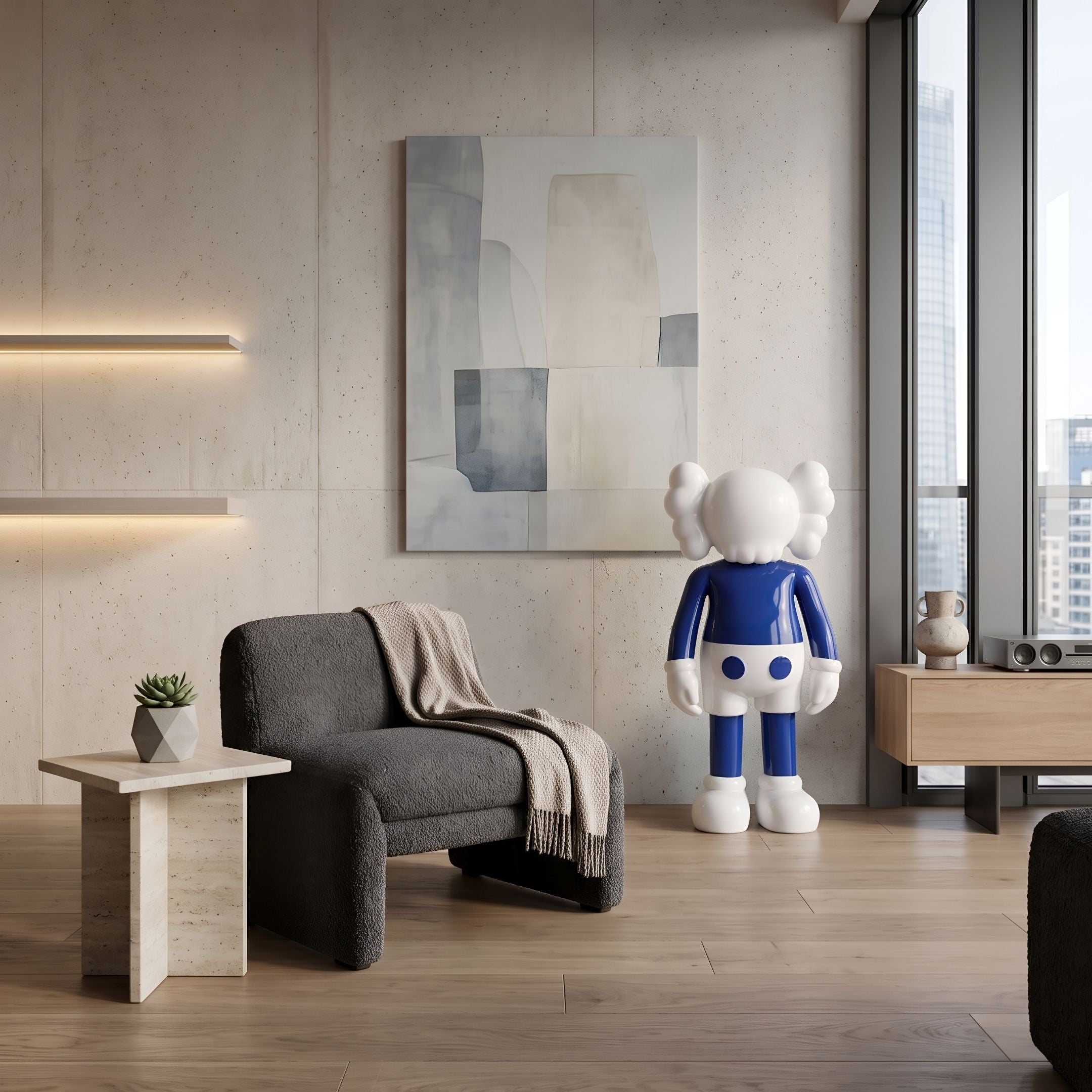 Deep Blue Iconify Standing Sculpture, 135cm, in a living room beside a dark armchair, wood side table, and abstract wall art.