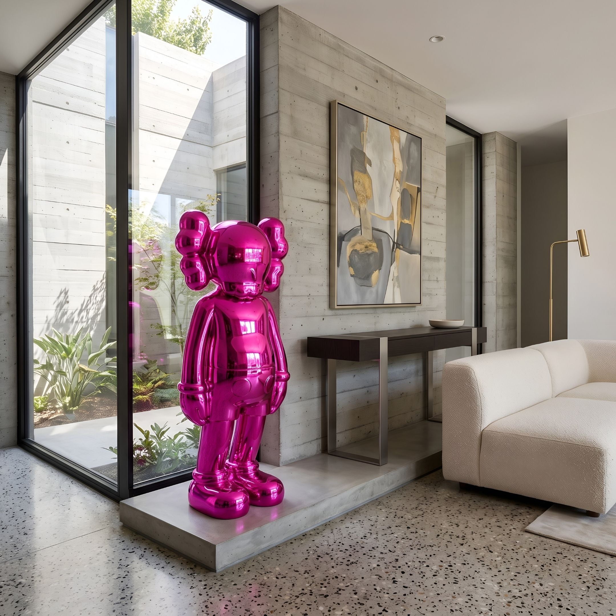 Lush Pink Iconify Standing Sculpture, 135cm glossy pink resin figure on a concrete base, displayed by a glass wall in a modern living room with a cream sofa.