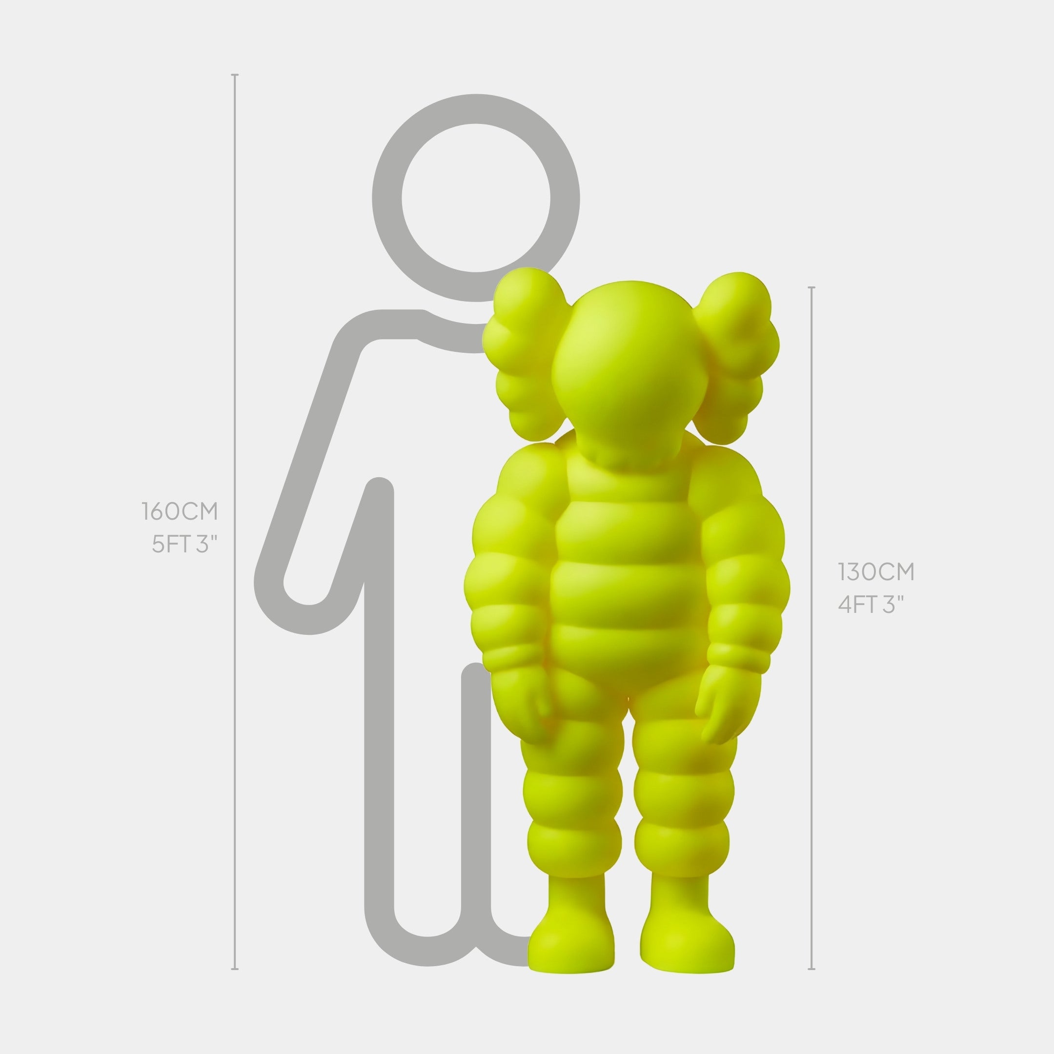 The Citrus Yellow Iconify Rollo Sculpture by Giant Sculptures, a lime green, puffy humanoid figure, stands at 130 cm (4 ft 3 in) in front of an outlined human silhouette measuring 160 cm (5 ft 3 in), showcasing playful proportions typical of modern art.