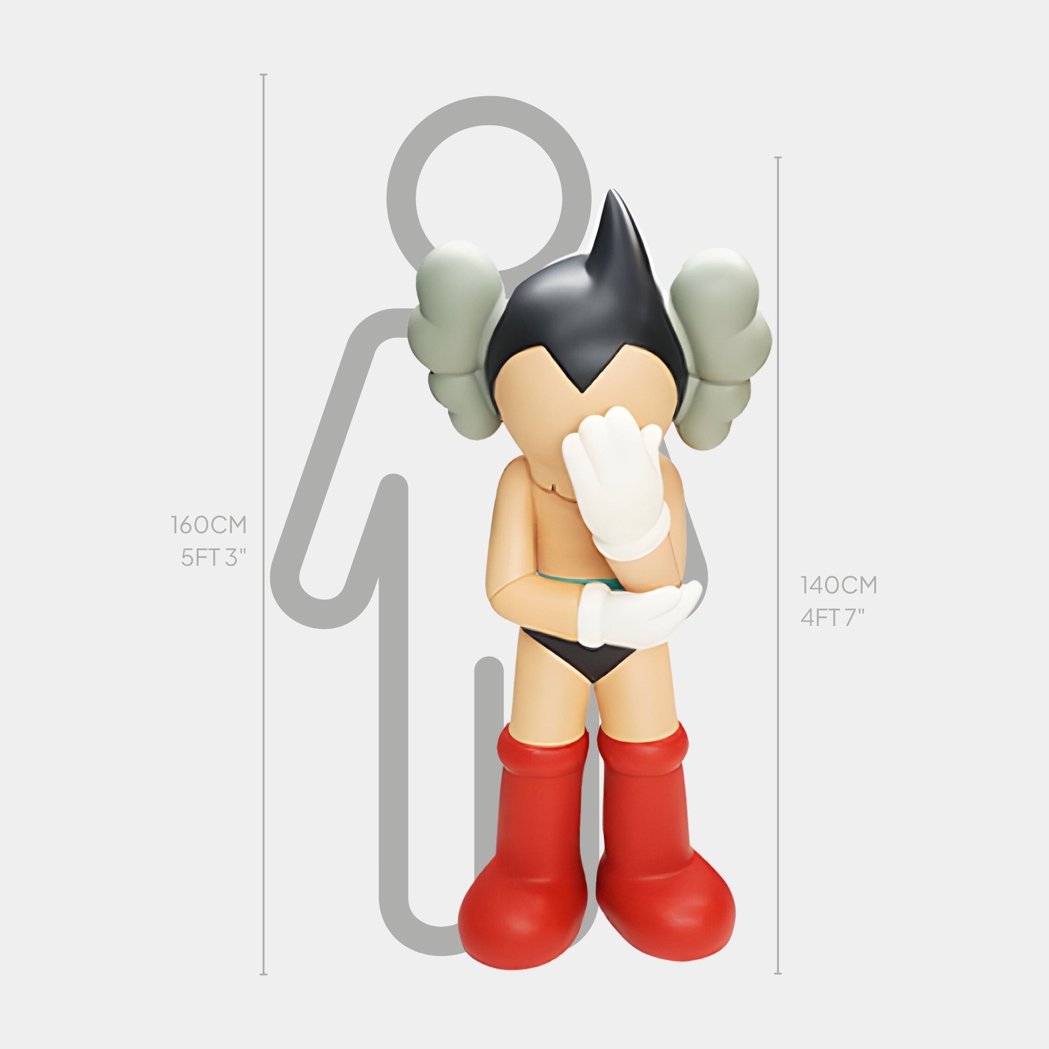 A cartoon figure with spiky black hair, red boots, and green gloves hides its face beside a height chart. Known as the Fiery Red Iconify Cosmic Boy Sculpture by Giant Sculptures, it stands 140cm tall. A mysterious silhouette looms in the background.