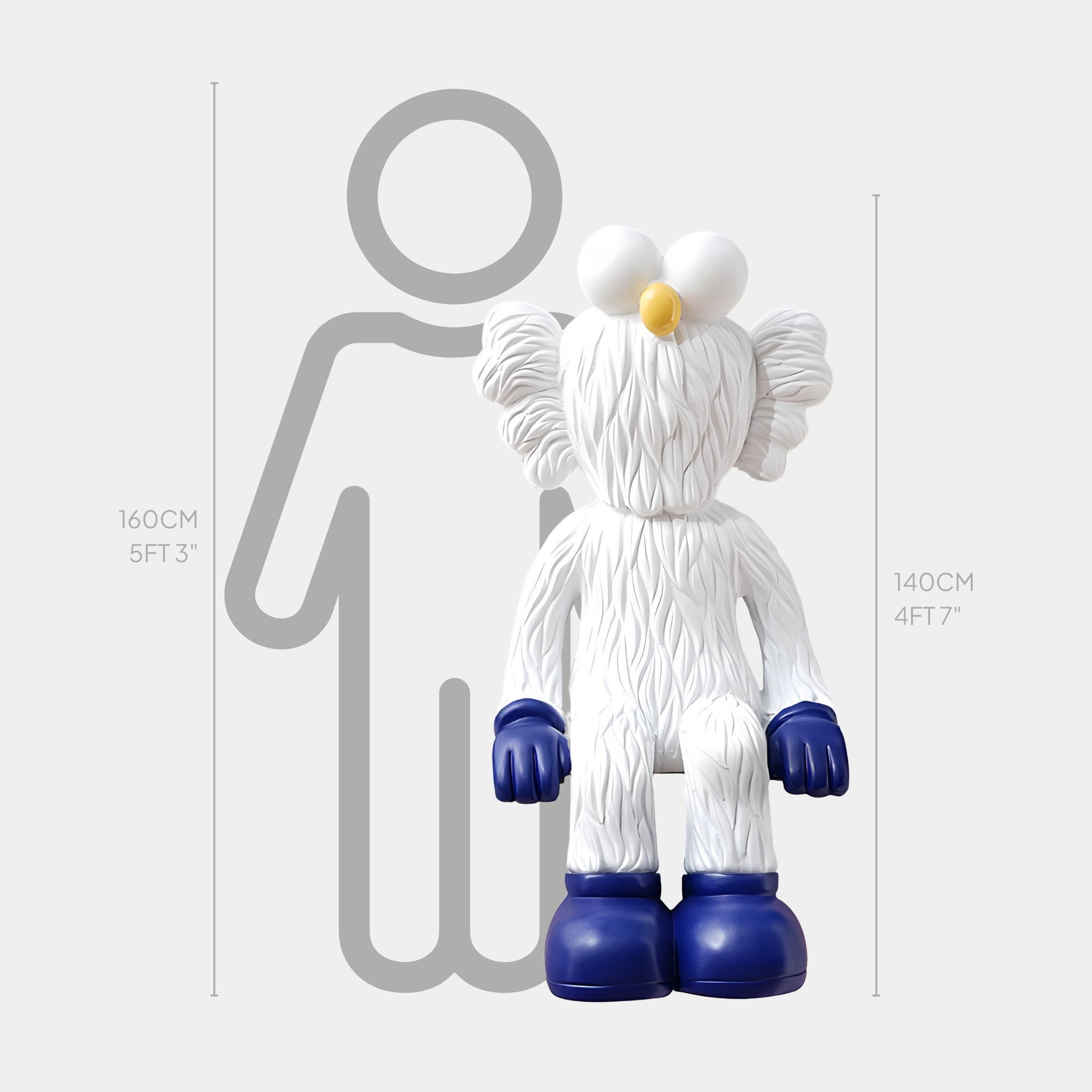 The White & Blue Iconify Furry Sitting Sculpture by Giant Sculptures features a 140 cm tall white furry character with blue gloves and shoes, contrasted against a 160 cm silhouette.