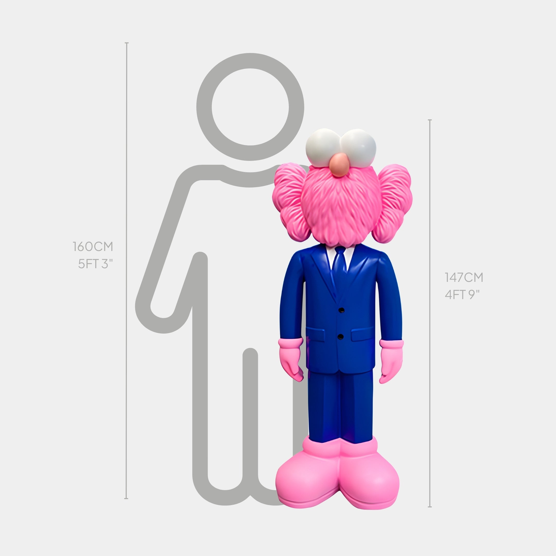 A pink cartoon figure in a cobalt blue suit, 147 cm tall, stands beside a 160 cm gray outline, echoing modern art. This evokes the dynamic presence of the Cobalt Blue Suit Iconify CEO Sculpture by Giant Sculptures.