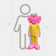 The Sunbeam Yellow Suit Iconify CEO Sculpture by Giant Sculptures features a pink cartoon figure in a modern pop art style, standing before a 160 cm gray outline of a human. The resin sculpture itself measures 147 cm tall.