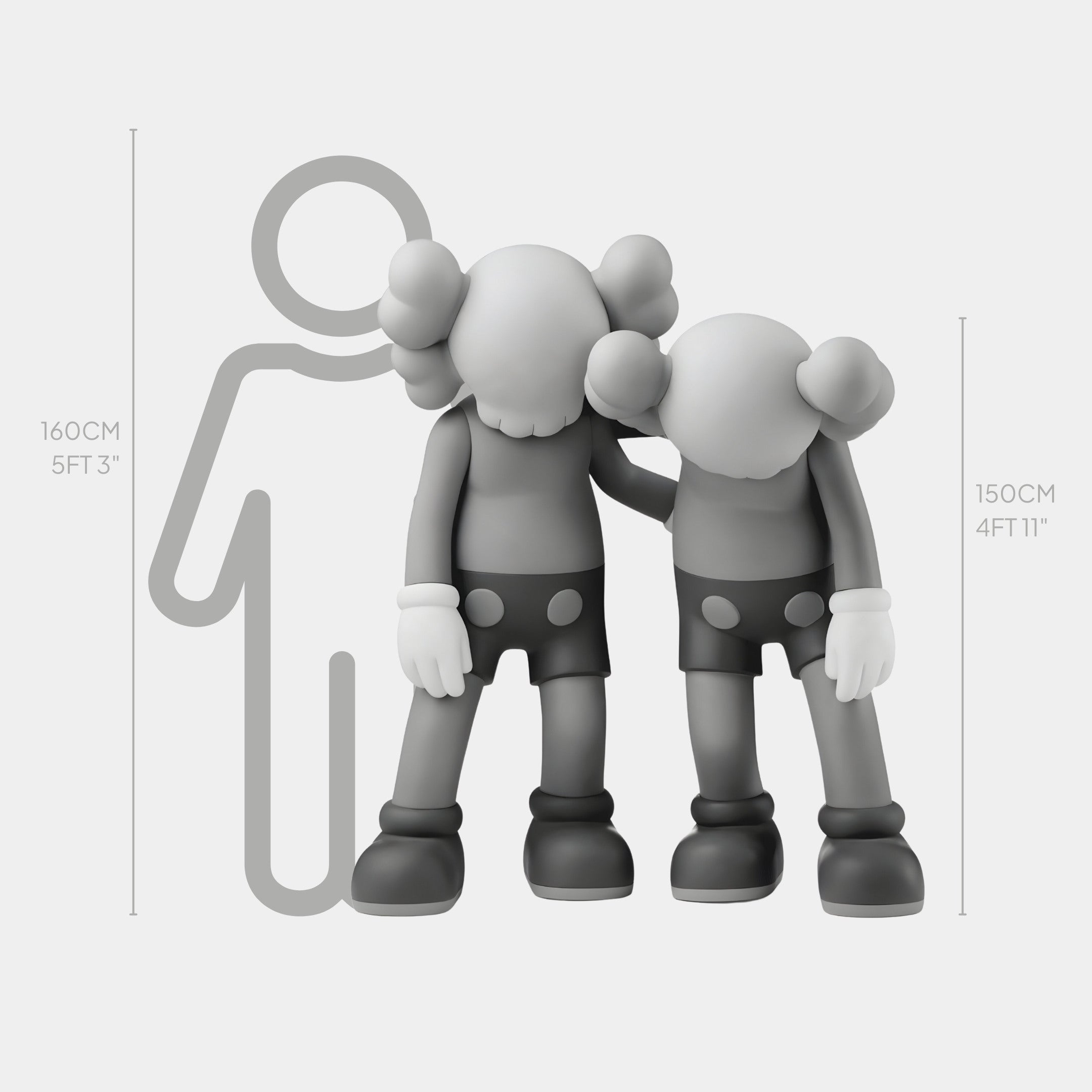 The Slate Grey Iconify Friendship Sculpture by Giant Sculptures, standing at 150 cm, features two cartoonish monochrome figures with X eyes and round ears beside a taller figure wrapping an arm around them as part of this contemporary décor piece.