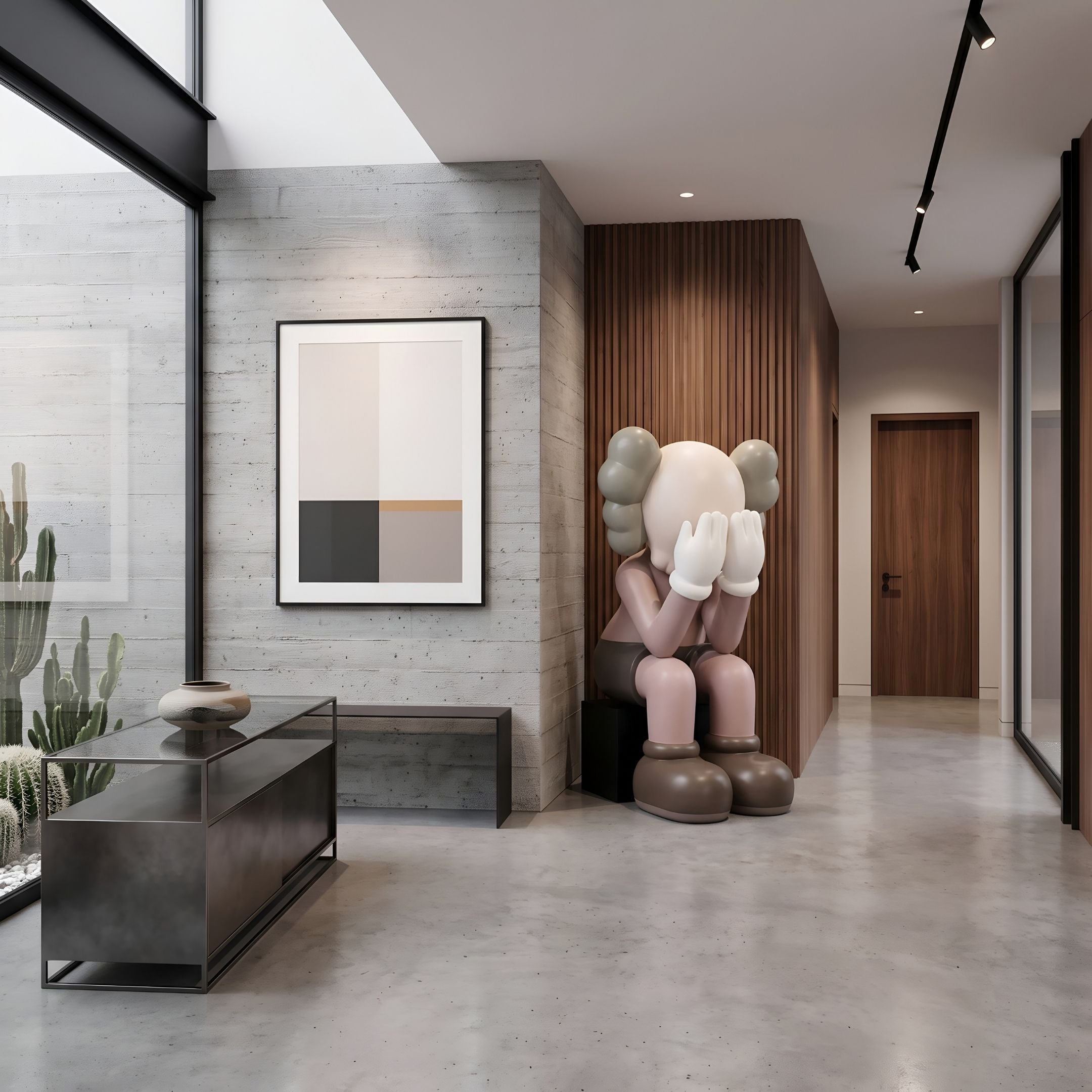 Hazelnut Brown Iconify Melancholy Sitting Sculpture, 163cm, seated figure covering face, in a hallway with wood paneling, concrete wall, and framed art.
