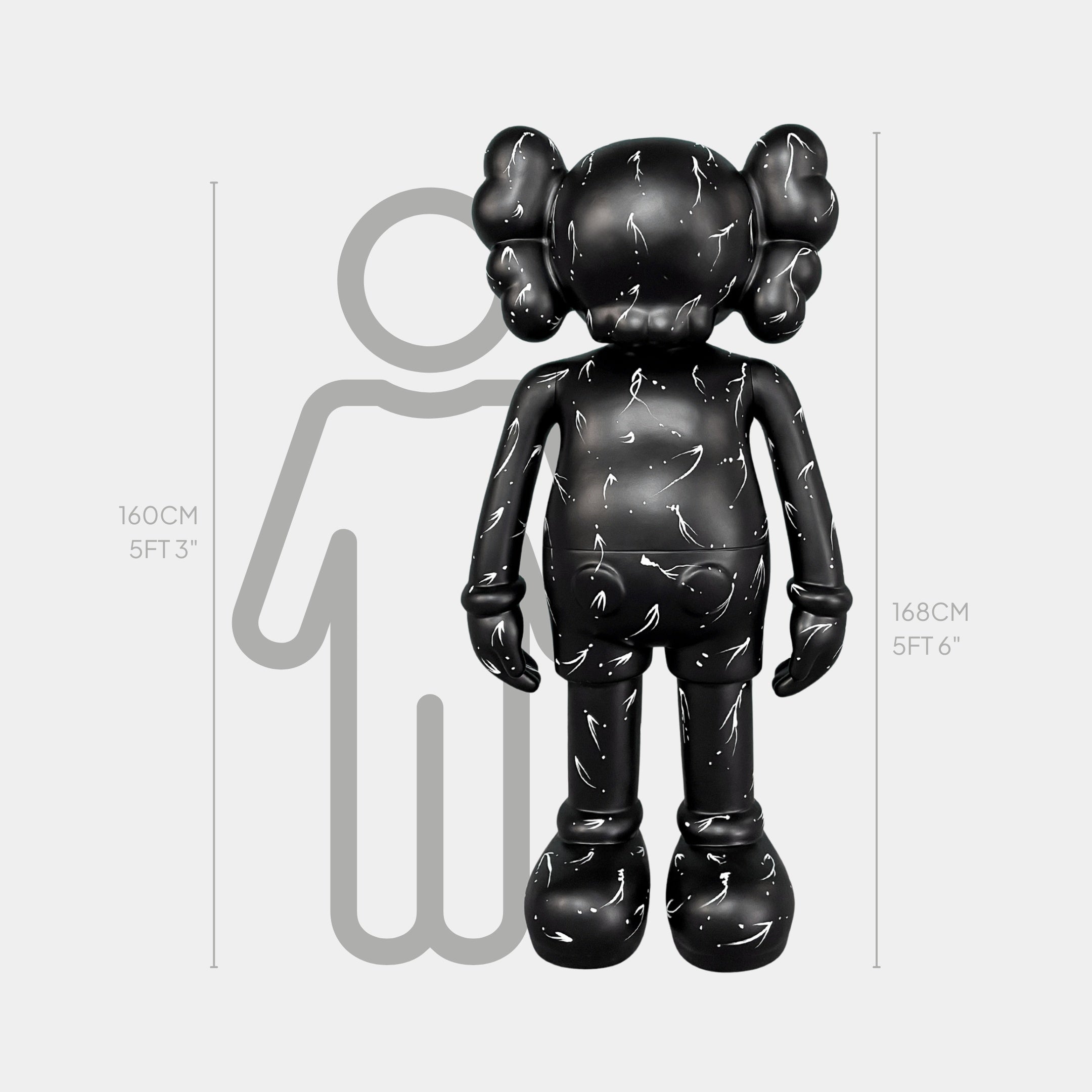 A black cartoon-like figure, the Black Stone Iconify Standing Sculpture - 168cm by Giant Sculptures, with crossed-out eyes stands before a height chart at 160 cm, with a gray human outline behind it measuring 168 cm.
