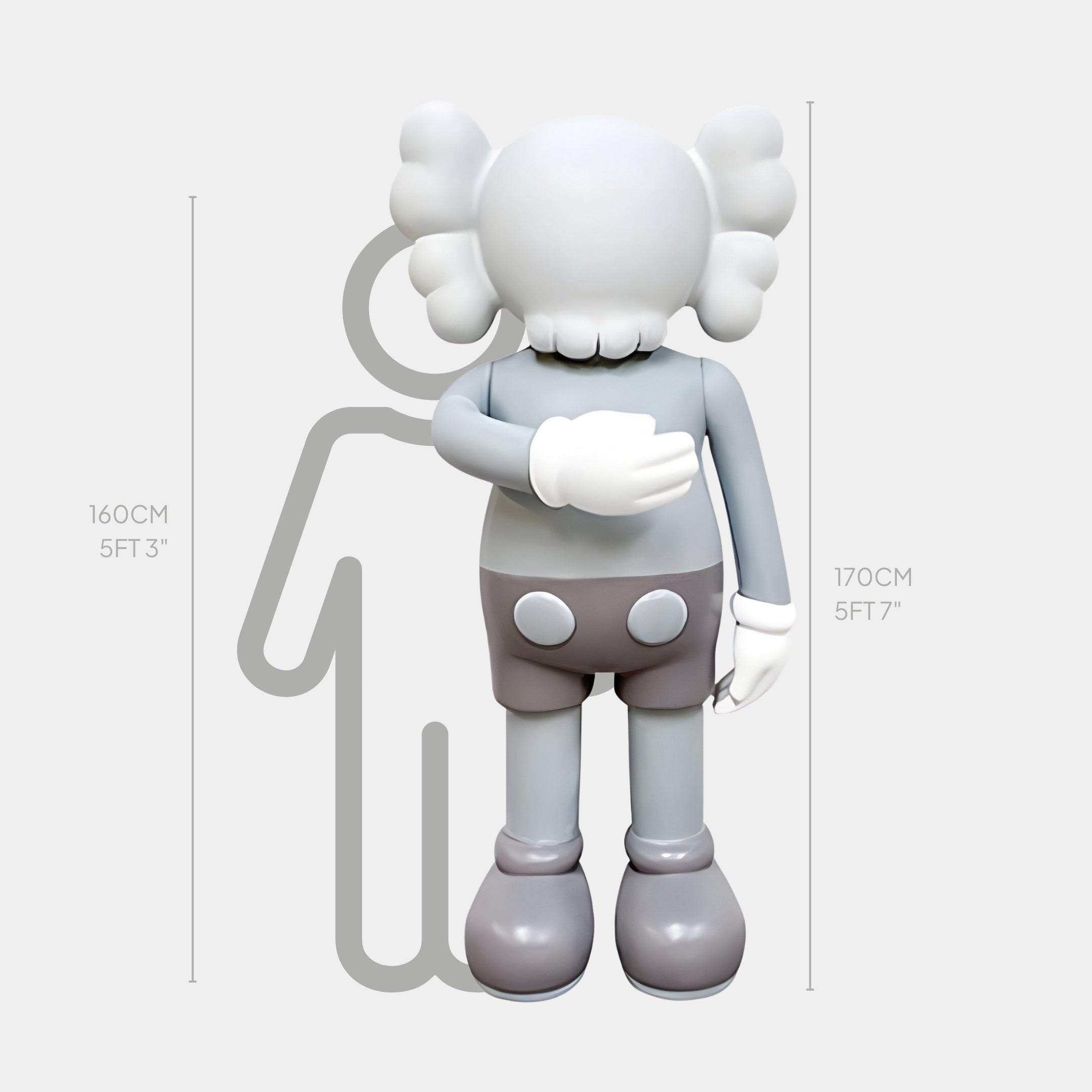 The Soft Grey Iconify I Dance Sculpture by Giant Sculptures is a 170 cm gray and white statue, resembling a toy with large ears, standing opposite an outlined figure for scale, bringing artistic sophistication to any setting.