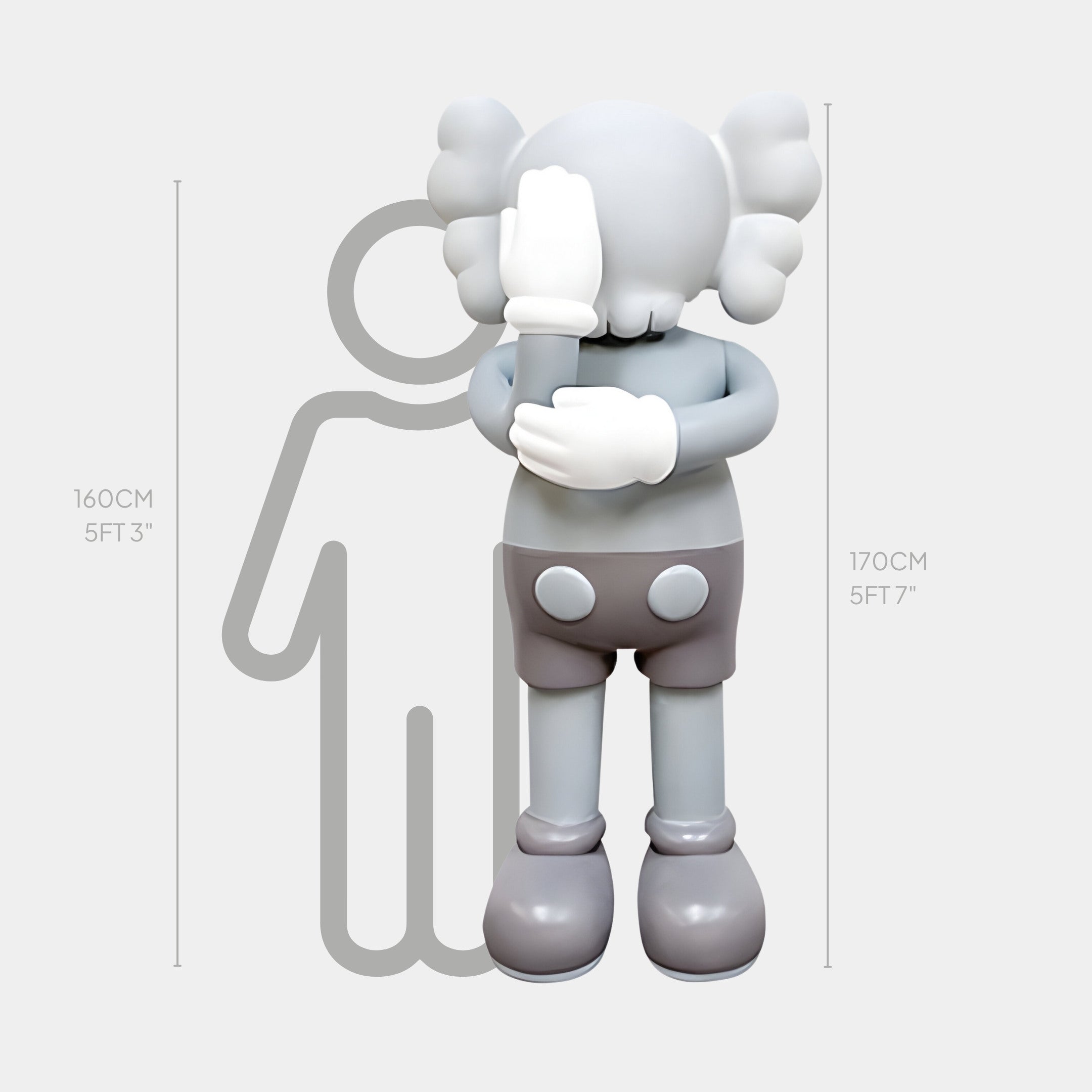 A cartoon-style figure with gloved hands covers its face beside a height comparison diagram. The 160 cm tall figure stands next to the 170 cm Soft Grey Iconify III Dance Sculpture by Giant Sculptures, embodying an elegant fusion of form and motion.