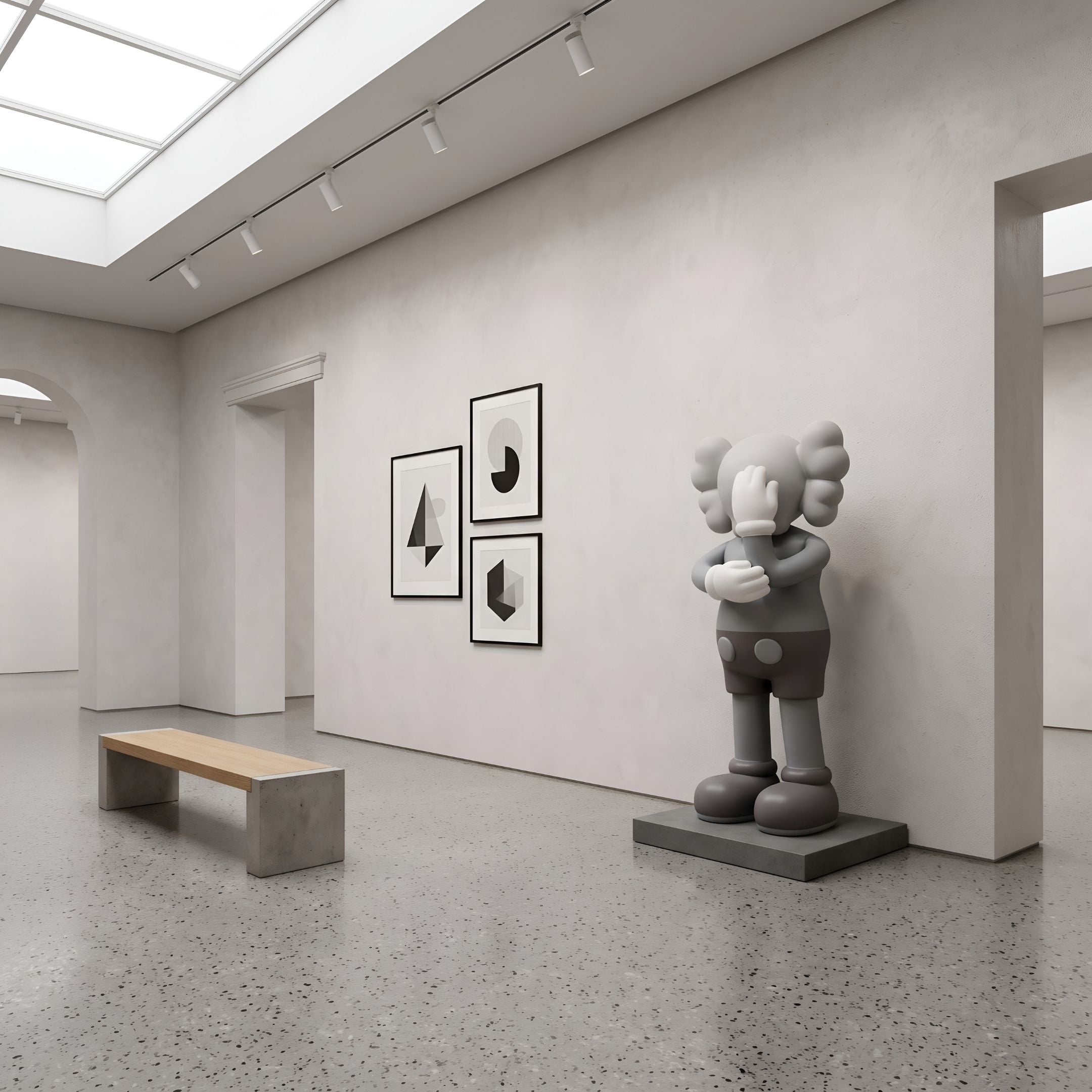 Soft Grey Iconify IV Dance Sculpture, 170cm, standing on a grey plinth against a gallery wall beside framed geometric prints and a wooden bench.