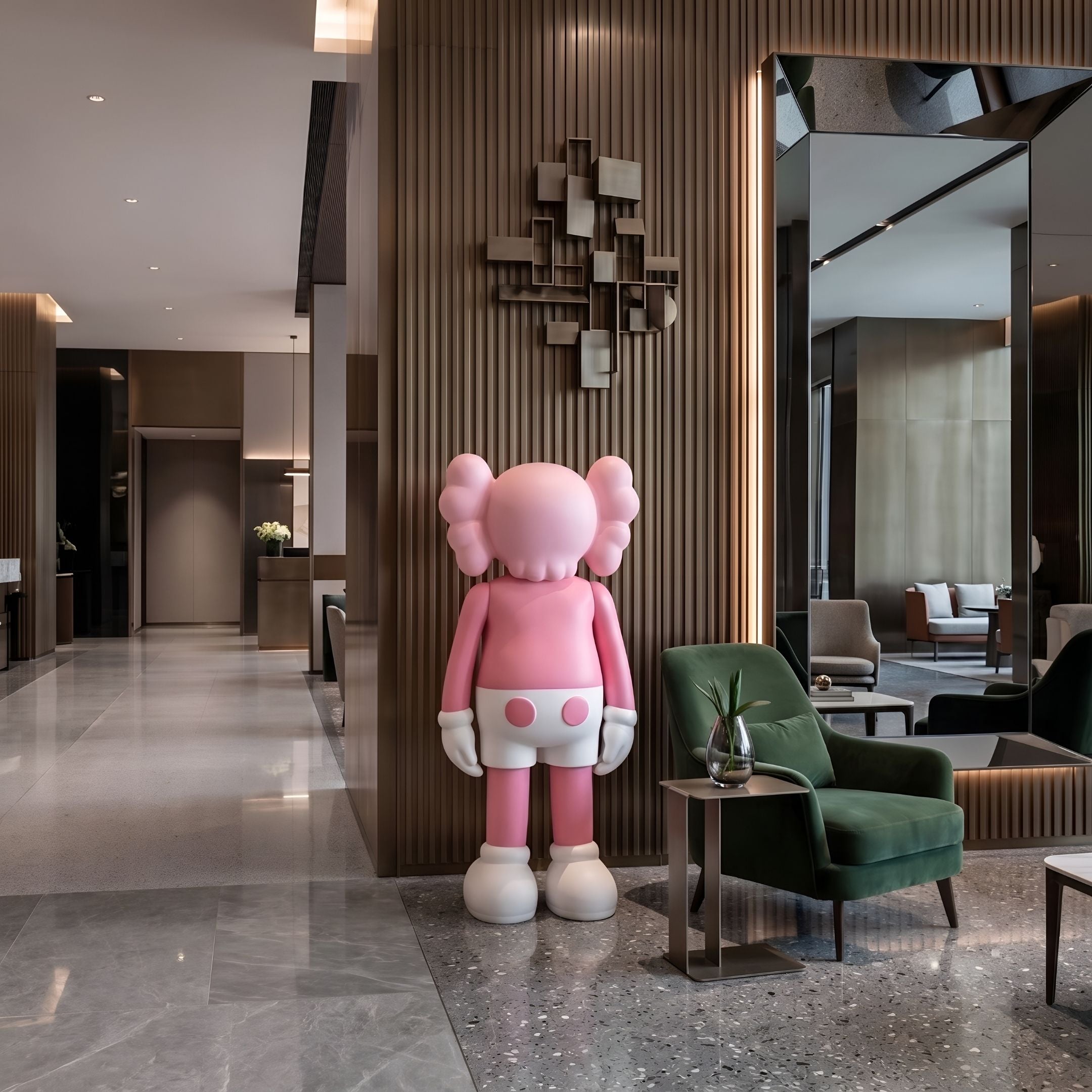 Soft Pink Iconify Standing Sculpture, 170cm, resin figure with white gloves and shoes, shown in a hotel lobby beside a green armchair and mirrored wall panel.