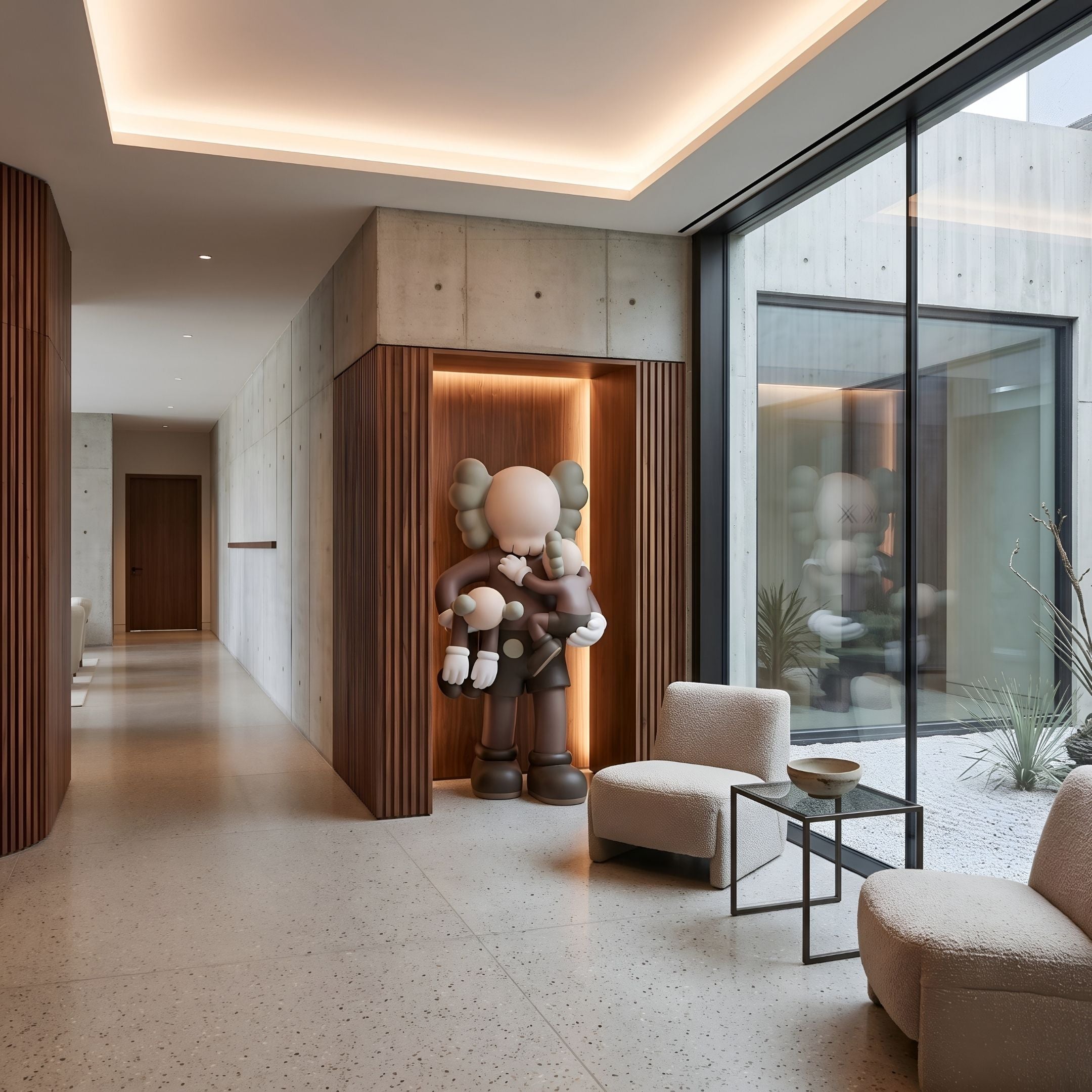 Hazelnut Brown Iconify Family Sculpture, 180cm, resin figure holding two children, displayed in a wood-paneled hallway niche beside a lounge seating area.
