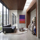 Hazelnut Brown Iconify Blue Furry Toy Sculpture, 180cm, shown beside a media console in a living room with a dark sofa and abstract wall art.