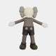 A 20cm Hazelnut Brown Iconify Floating Bath Figure by Giant Sculptures, with a smooth face, large ears, white gloves, dark shorts, and exaggerated limbs stands outstretched in a modern silhouette.