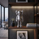 Titanium Slate Iconify Standing Figure - 20cm in metallic silver on a wood shelf, styled with books, a black vase, and framed wall art.