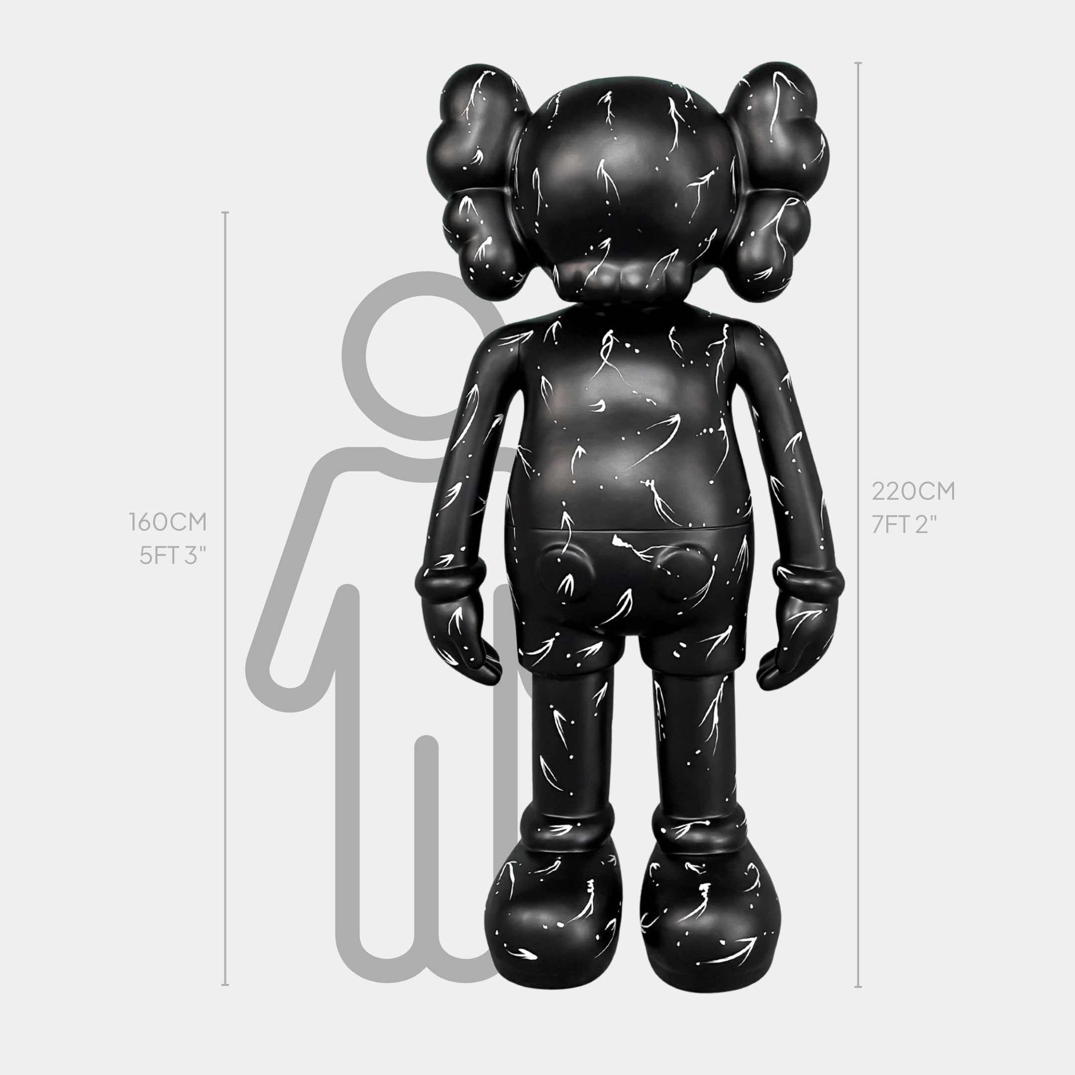 The Giant Sculptures Black Stone Iconify Standing Sculpture - 220cm stands impressively tall before a size chart, its striking height and white markings emphasizing its bold presence as a contemporary interior showpiece.