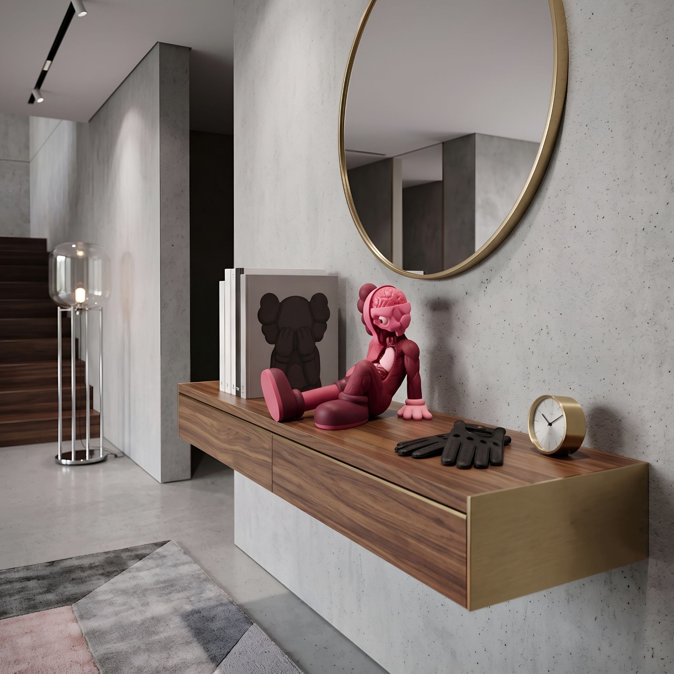 Blush Ruby Iconify Anatomy Figure, 23cm, seated pink and ruby-red collectible sculpture styled on a walnut floating console beneath a round gold mirror.
