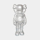 The Giant Sculptures Polished Chrome Silver Iconify Enforcer Figure - 26cm stands upright against a white backdrop, showcasing its cartoonish design, X-eyes, and unique ear-like shapes. This piece encapsulates modern artistry with a futuristic flair.