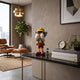 Iconify Marionette Figure - 26cm by Giant Sculptures, hidden-face puppet duo in yellow hat and red shorts, displayed on a console table beside books and a clock.