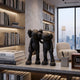 Midnight Black Iconify Friendship Figure, 28cm, two matte black stylised figures with X-mark eyes on a shelf in a modern study with city-view window.