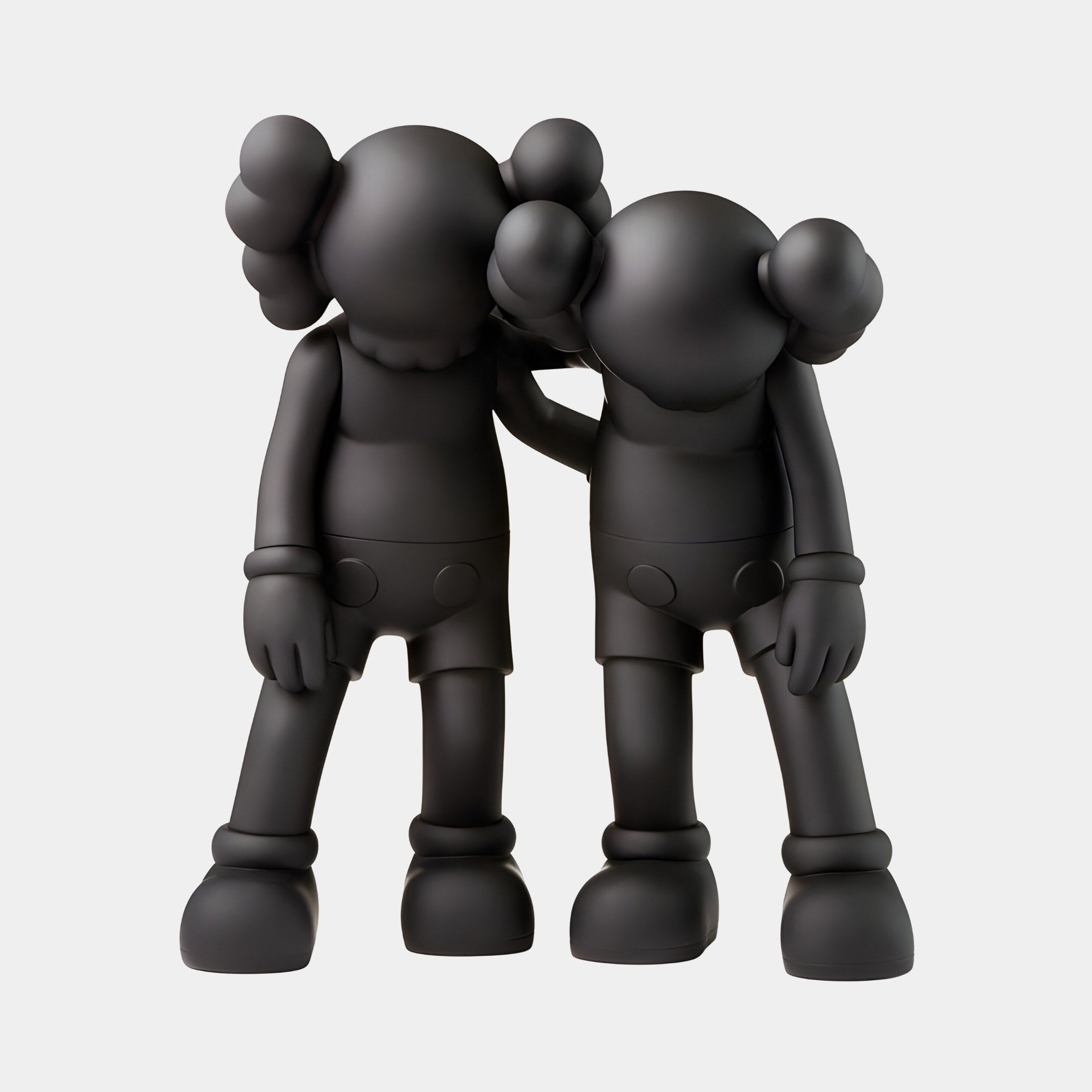 The Midnight Black Iconify Friendship Figure by Giant Sculptures is a 28cm resin sculpture with two cartoonish figures featuring midnight black bodies, large round ears, and big shoes, where one lovingly drapes an arm around the others shoulder.