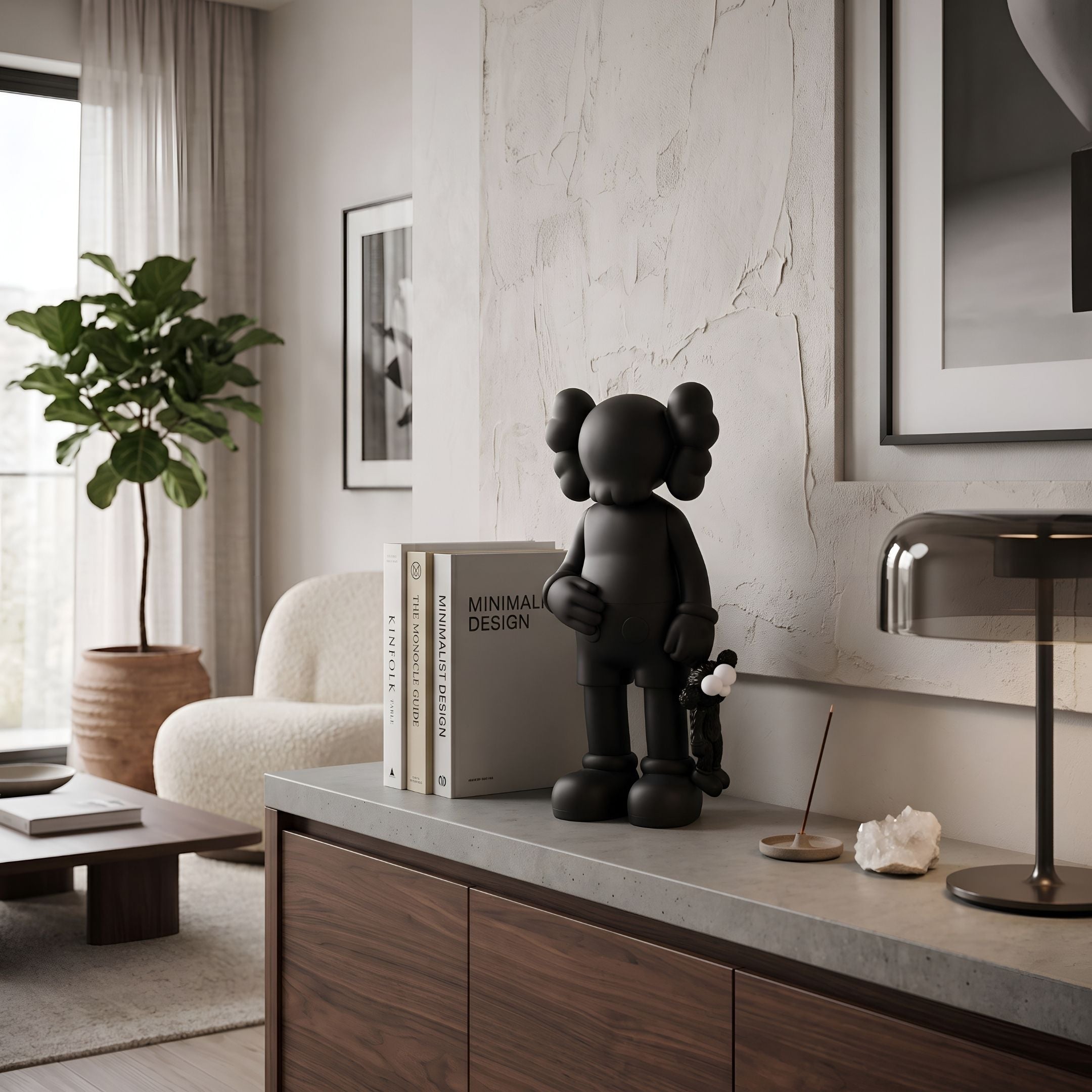 Midnight Black Iconify Black Furry Toy Figure, 28cm matte black designer figure with X-shaped eyes, displayed on a sideboard beside books in a living room.