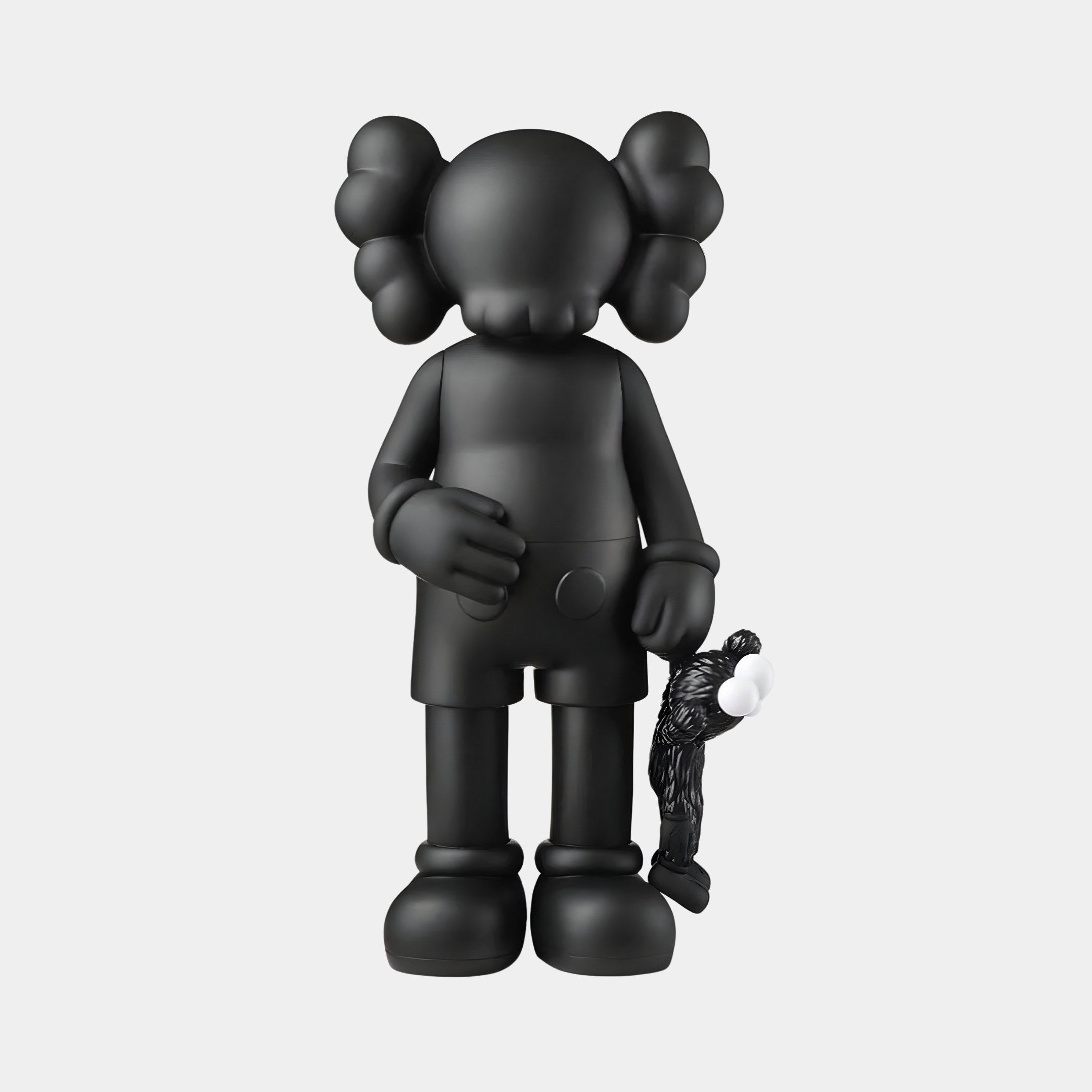 A modern collectible by Giant Sculptures, the Midnight Black Iconify Figure features Xs for eyes, large glove-like ears, and a round nose. At 28cm tall, it holds a smaller figure crafted from resin composite. Both showcase a cartoonish design against a plain white background.