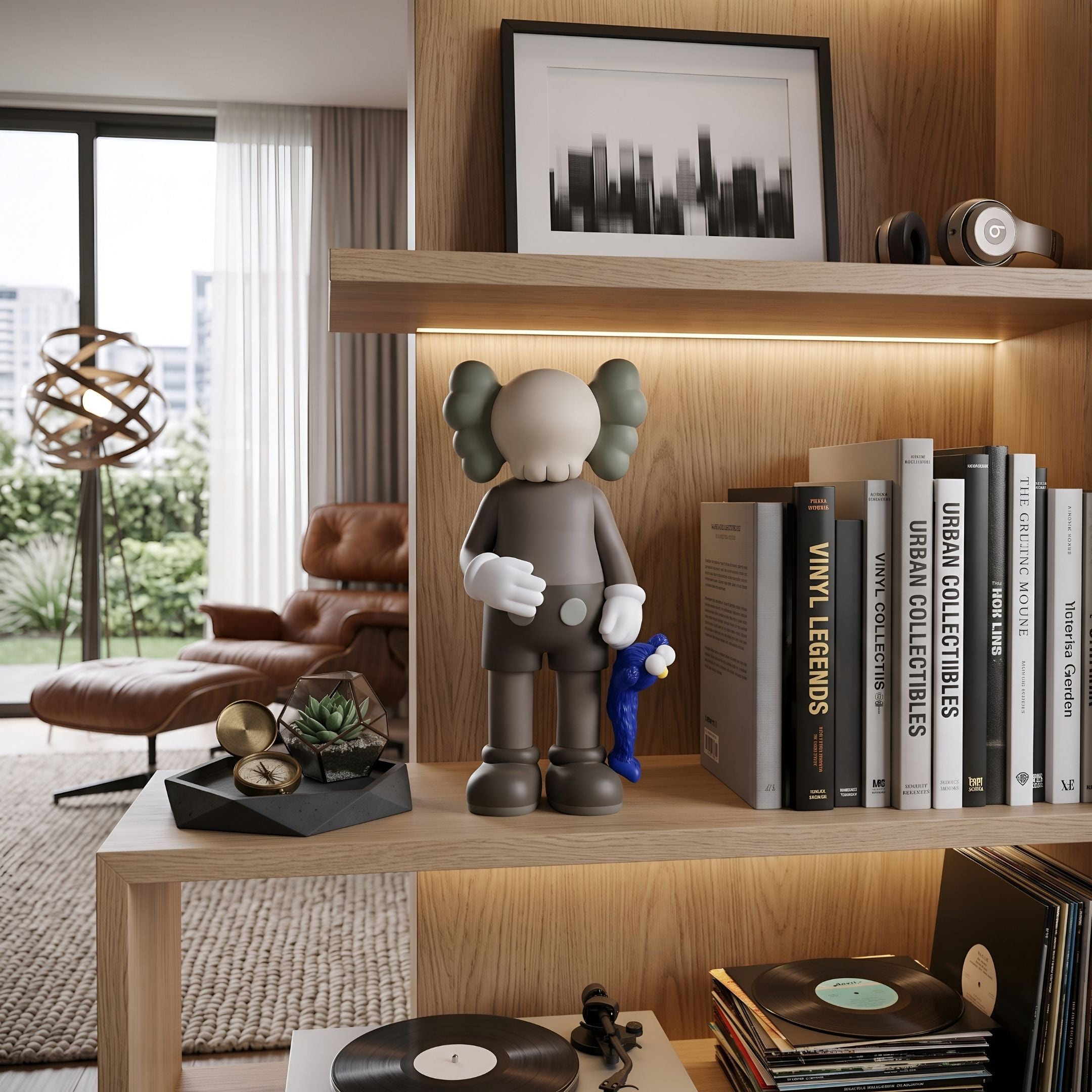 Hazelnut Brown Iconify Blue Furry Toy Figure, 28cm, on a wood bookshelf beside books and a framed cityscape print in a living room setting.