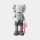 The 28cm Soft Grey Iconify Pink Furry Toy Figure by Giant Sculptures features a gray cartoon-style figure with rounded head protrusions, wearing shorts and shoes, holding a small pink character. Its perfect for adding quirky interior décor against a white background.