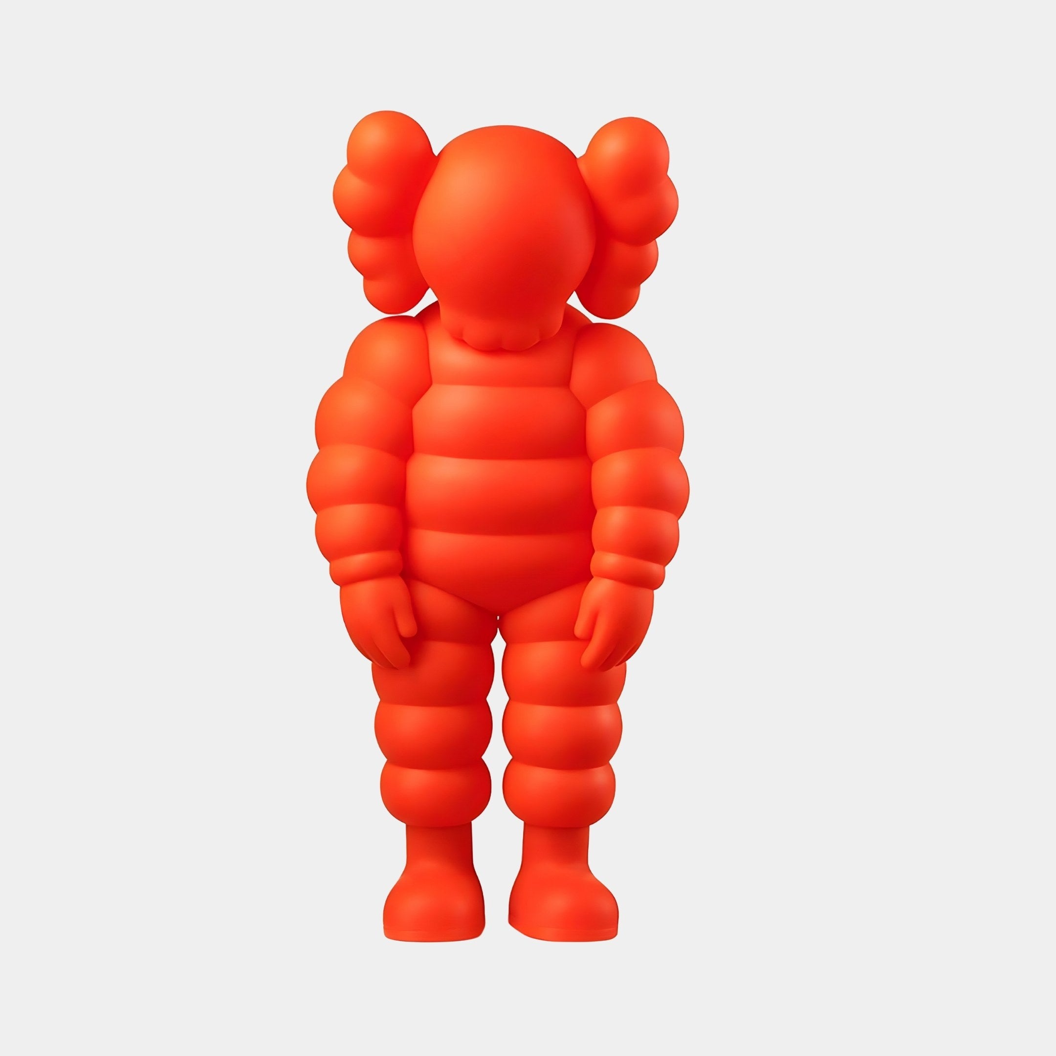 The Fiery Orange Iconify Rollo Figure by Giant Sculptures is a 28cm contemporary sculpture with a rounded, segmented body and round ears. It stands upright against a plain background, showcasing a high-gloss orange finish that enhances its abstract form.