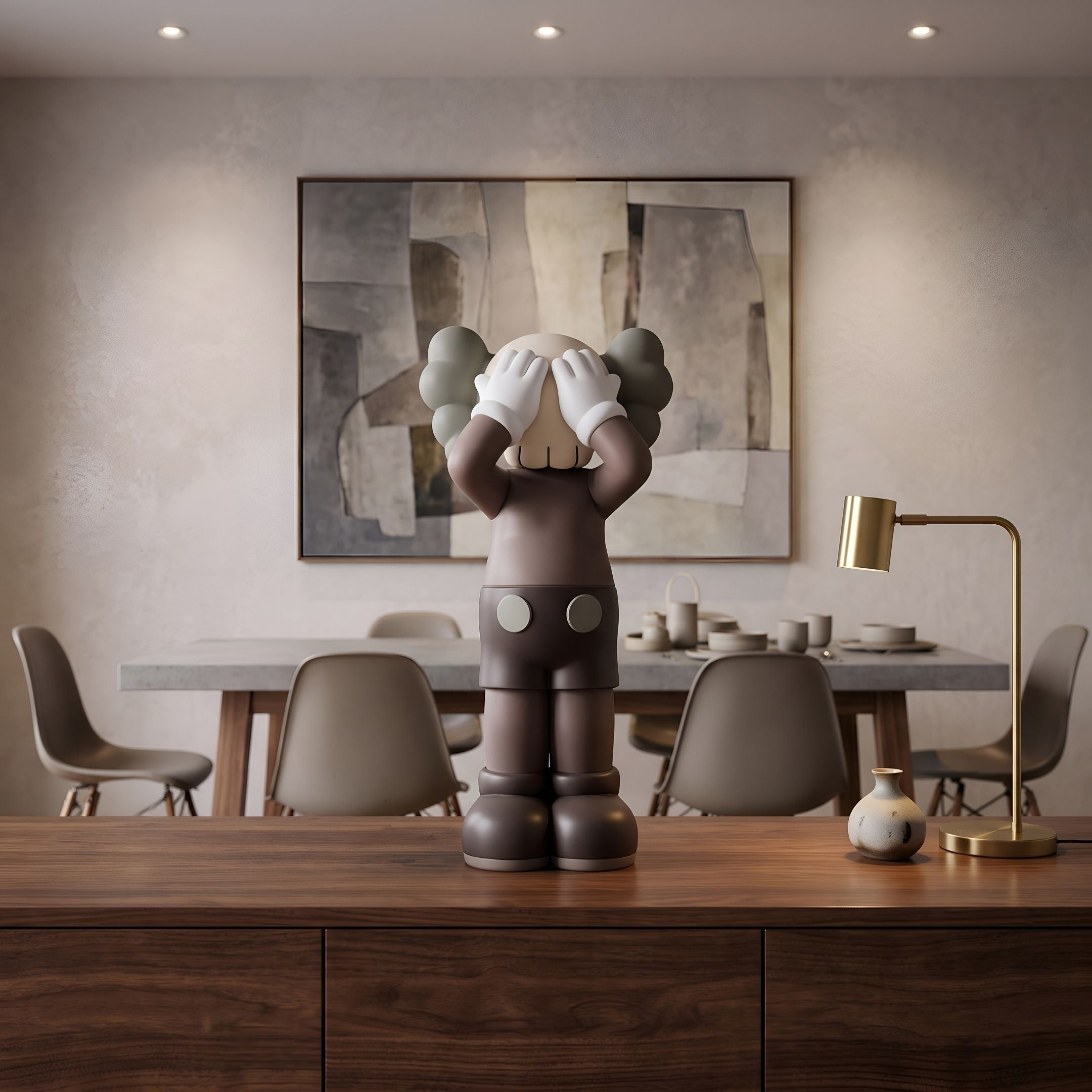 Hazelnut Brown Iconify Silent Cry Figure, 28cm, hands covering face, displayed on a wooden sideboard in a dining room with abstract wall art.