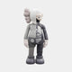 The Soft Grey Iconify Anatomy Figure by Giant Sculptures stands at 28cm, featuring a monochrome humanoid form split in half, with one smooth side and the other displaying detailed internal anatomy, making it ideal for modern interiors.