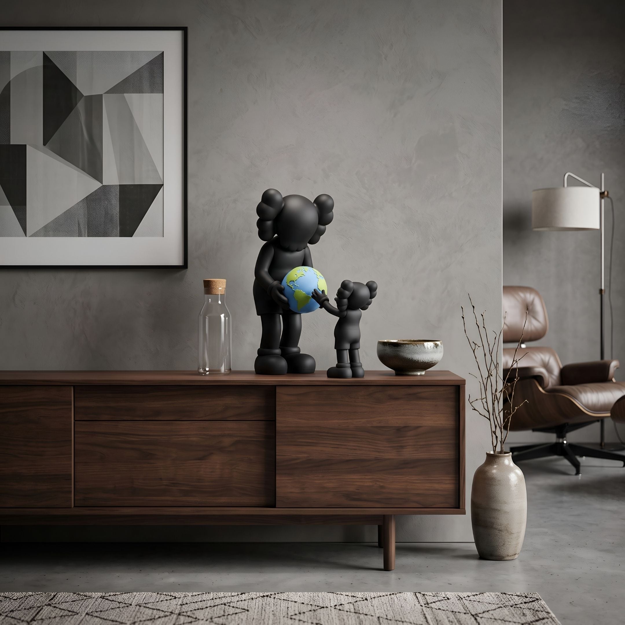 Obsidian Black Iconify Atlas Figure - 30cm, black polyvinyl sculpture of a tall and small figure holding a blue-green globe, displayed on a walnut sideboard in a living room.