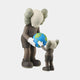 Two gray, cartoonish figures with X eyes and rounded ears stand on a white background. This high-quality Hazelnut Brown Iconify Atlas Figure by Giant Sculptures is 30cm and features the taller figure holding a globe while the smaller one reaches to touch it. Both wear dark outfits and white gloves.