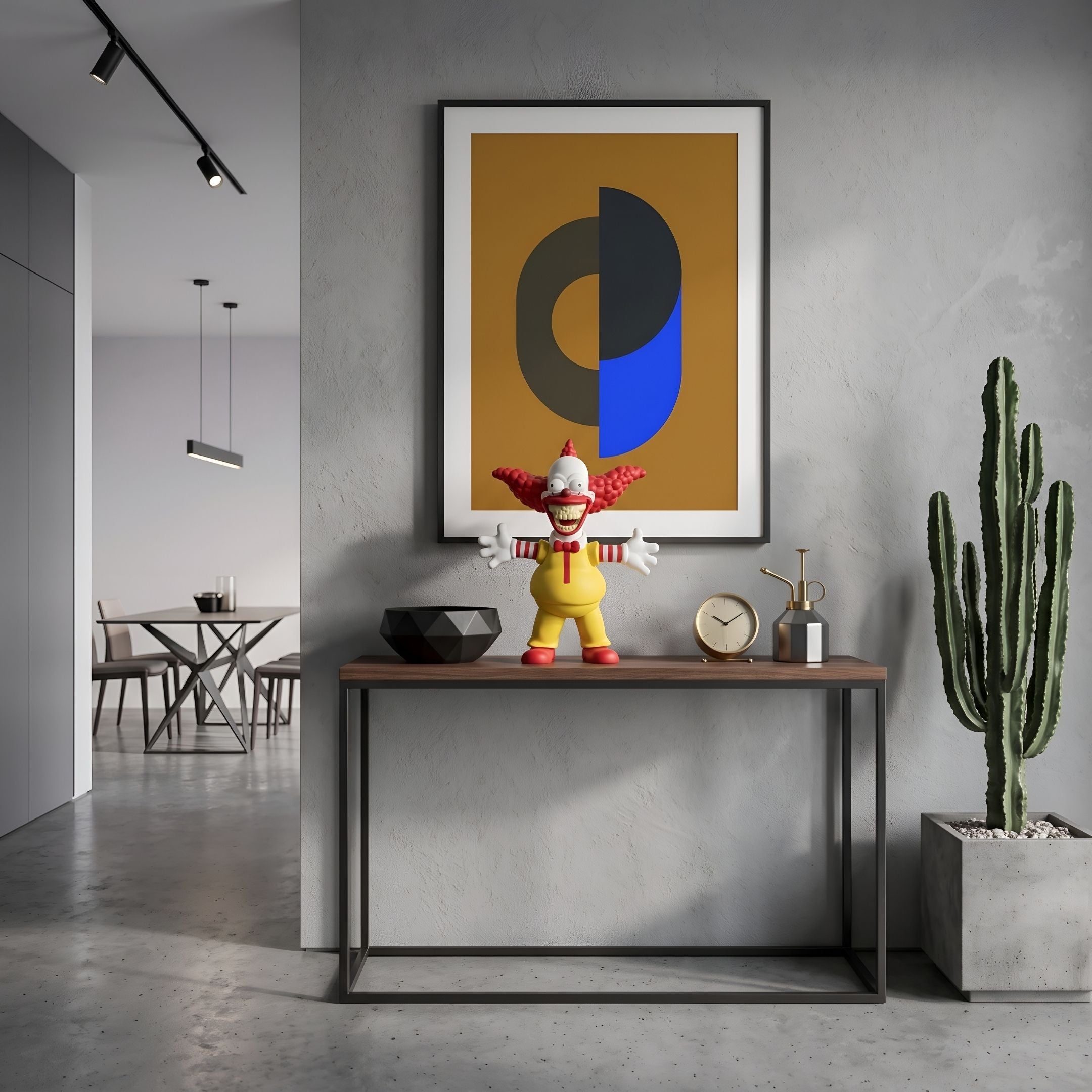 Golden Maize Yellow Iconify Chuckle Figure, 30cm, on a console table in a grey entryway beneath abstract wall art, near a cactus and clock.