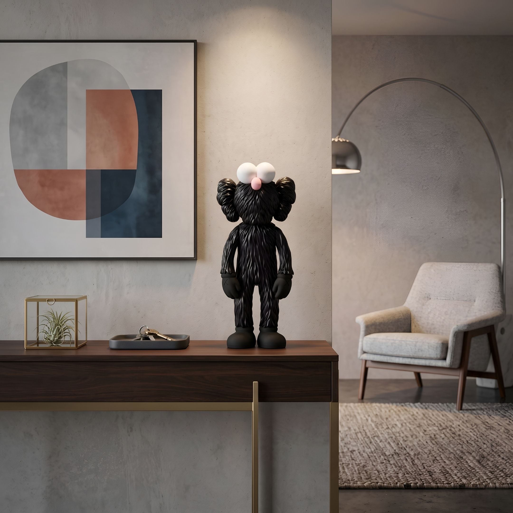 Obsidian Black Iconify Furry Figure, 30cm, on a console table with abstract wall art, lamp, and armchair in a modern living room setting.
