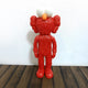 The Fiery Red Iconify Furry Figure by Giant Sculptures showcases a fuzzy toy with large white eyes, an orange nose, and exaggerated hands. Standing upright on wood against a plain white background, this 30cm collectible is a contemporary pop art must-have.