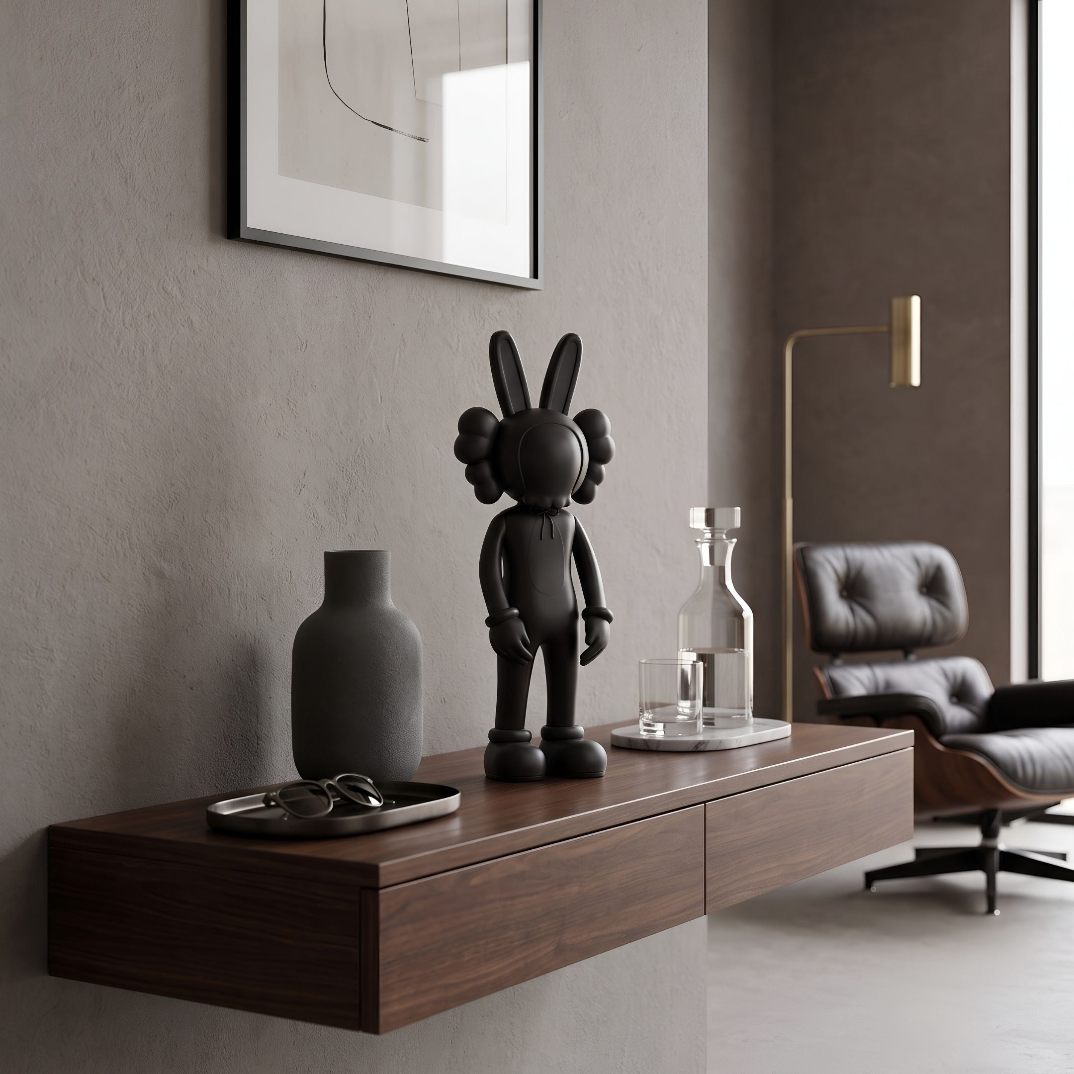 Obsidian Black Iconify Rabbit Figure, 30cm, on a floating walnut console with a vase, tray, and decanter in a modern living room.