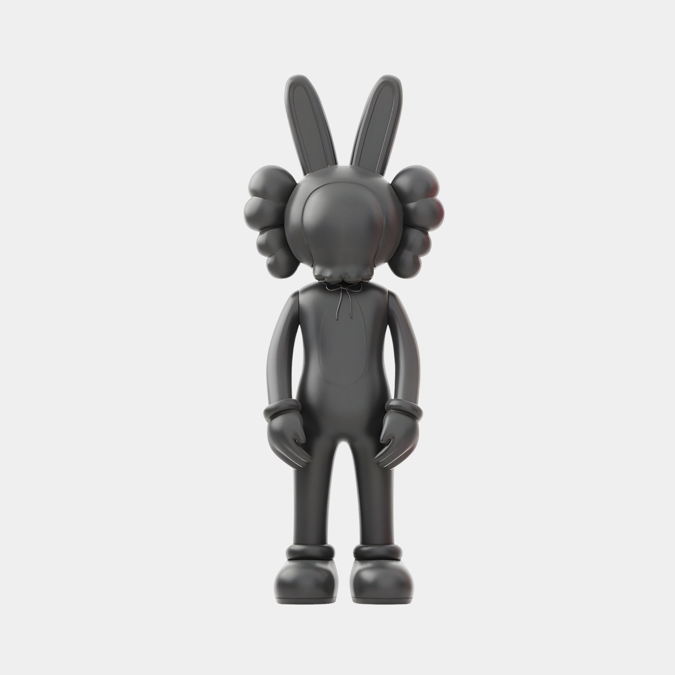 The 30cm Obsidian Black Iconify Rabbit Figure by Giant Sculptures is a striking decorative object with rabbit ears and round details on its head, standing upright against a plain white background, showcasing contemporary artistry with simplified forms and no visible facial features.