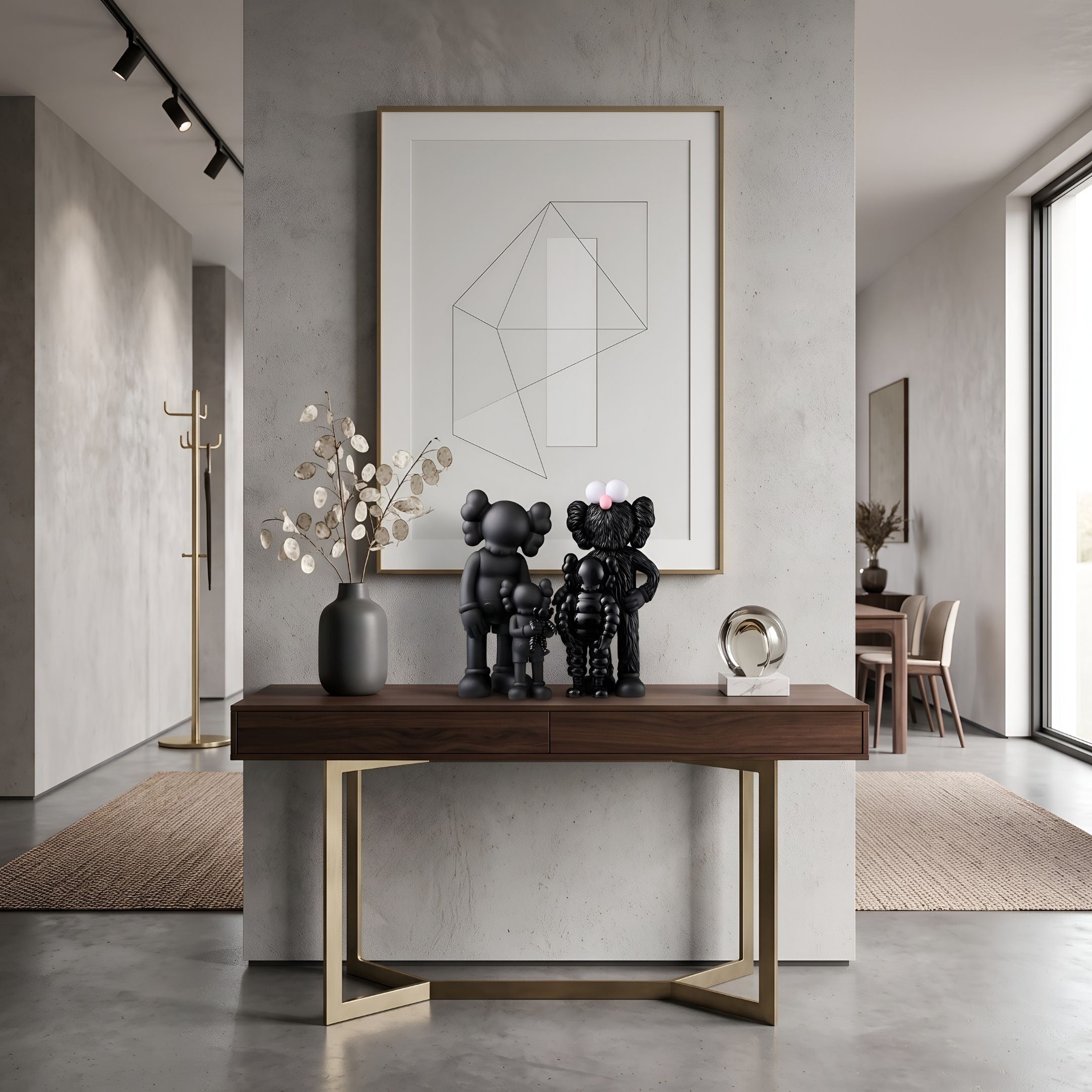 Iconify I All-Together Figure by Giant Sculptures, black stylised figures grouped on a wood console table beside a vase and framed line-art print.