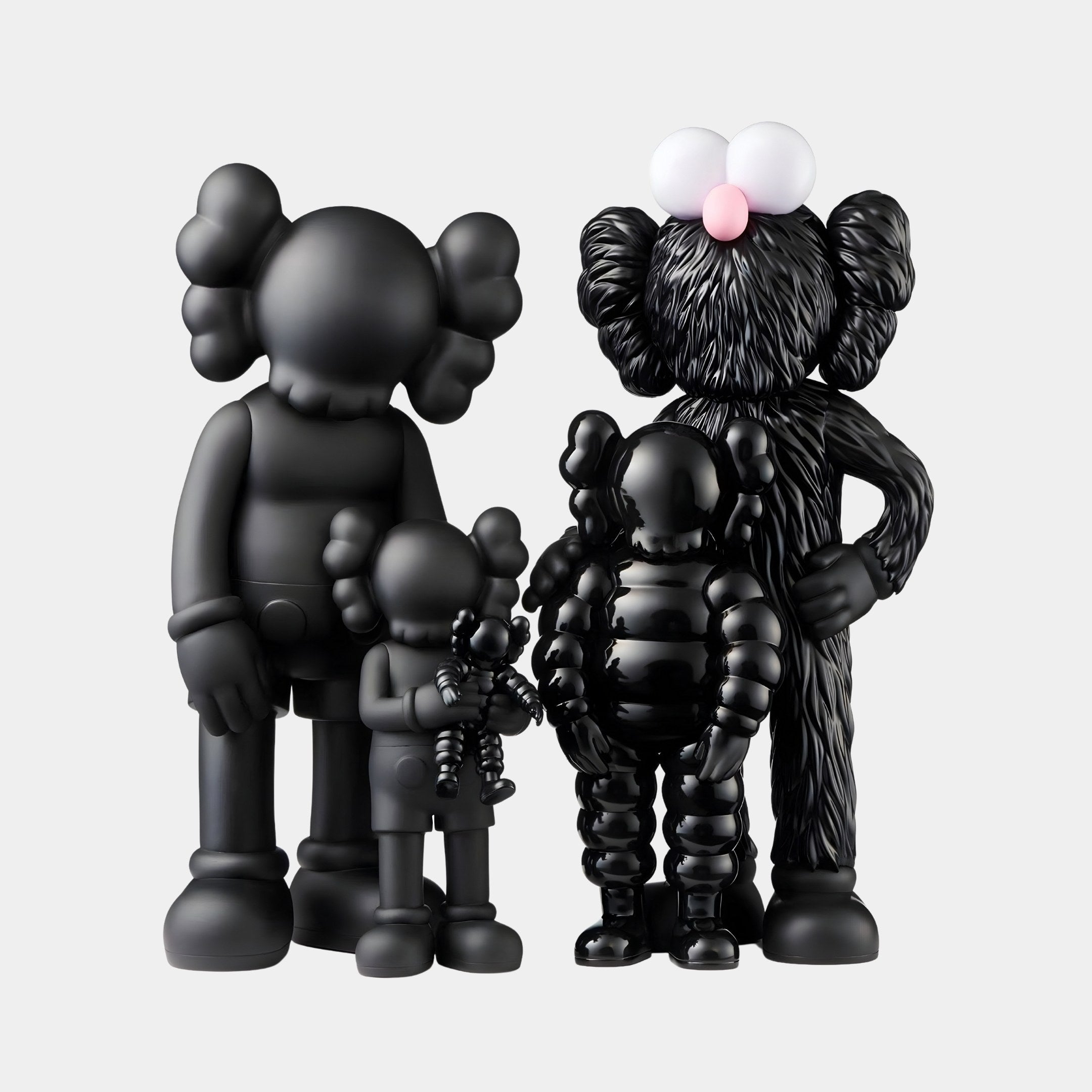 The Iconify I All-Together Figure by Giant Sculptures features four black, cartoon-like figures with round ears and exaggerated features in monochrome design. Styled minimally, one has a furry texture, capturing the essence of unity.